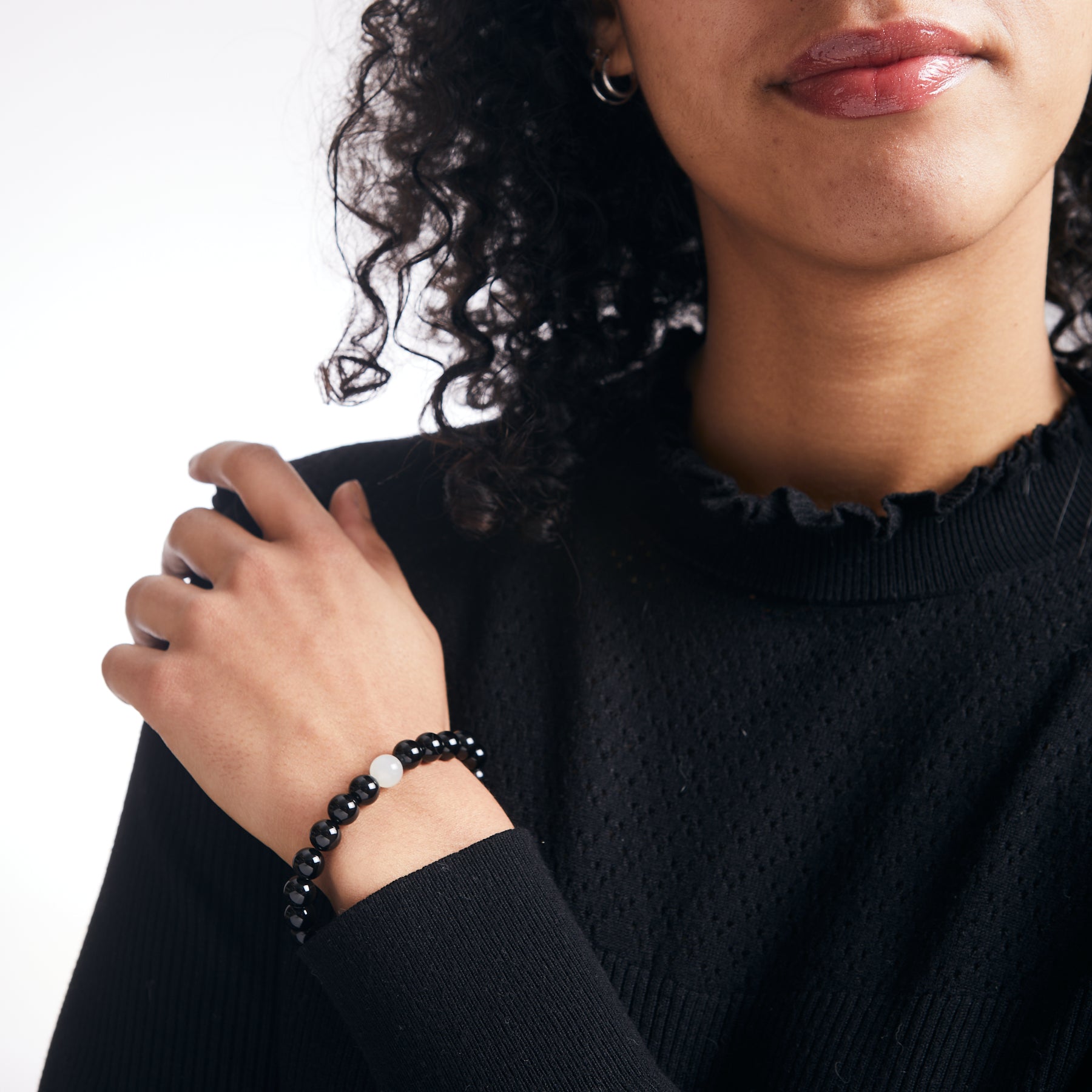 Black Tourmaline and White Moonstone beaded bracelet on model 