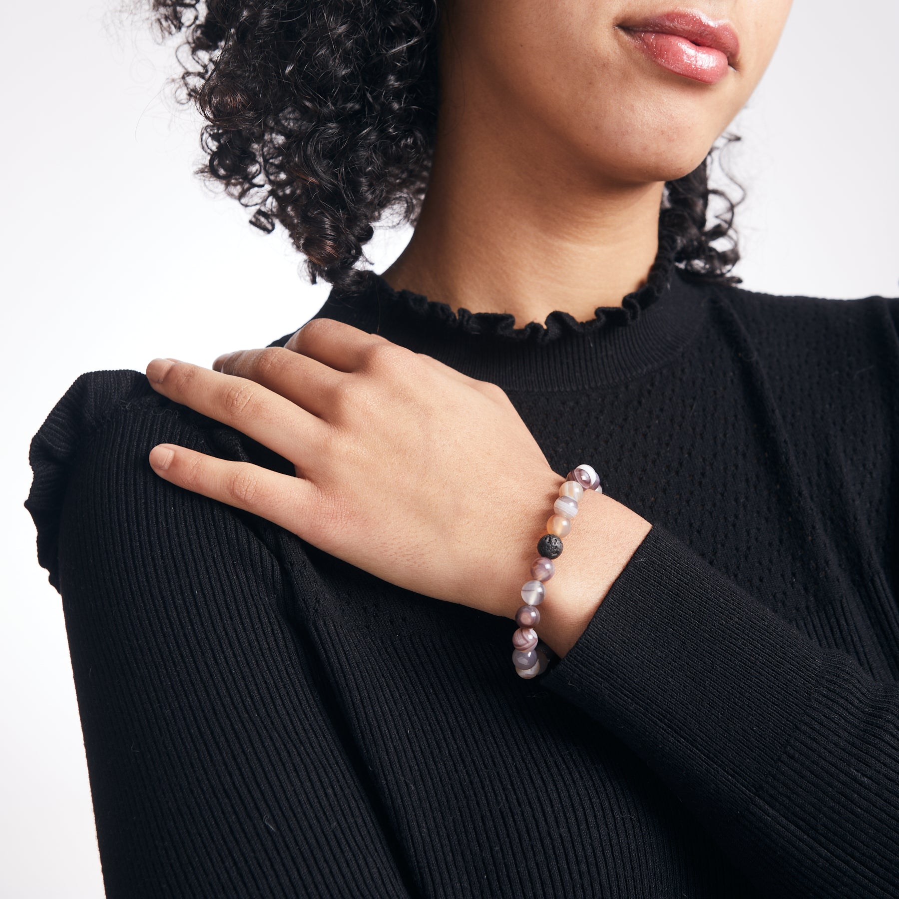 Botswana agate and lava stone beaded bracelet on model