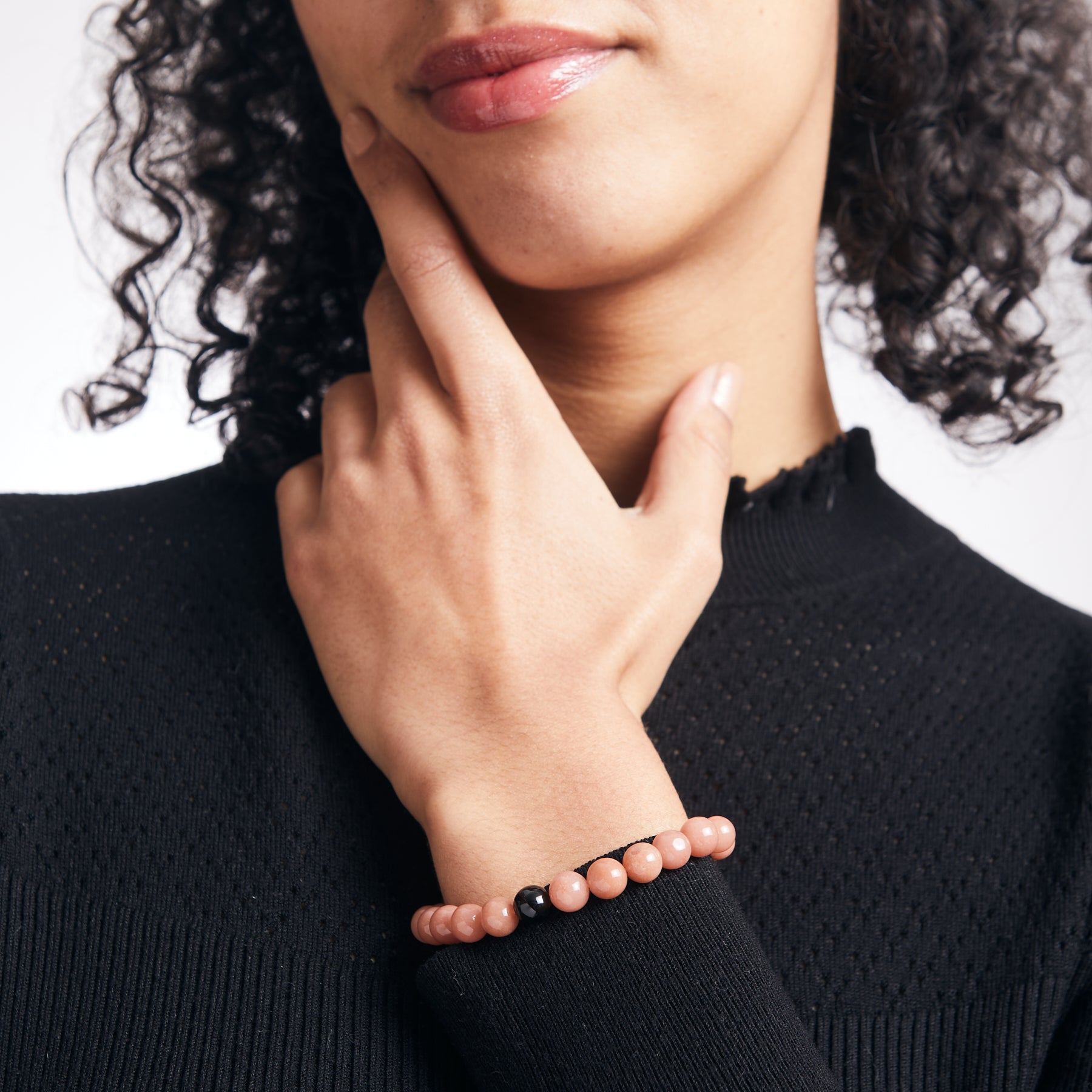 Peach Moonstone and Black Tourmaline beaded bracelet on model