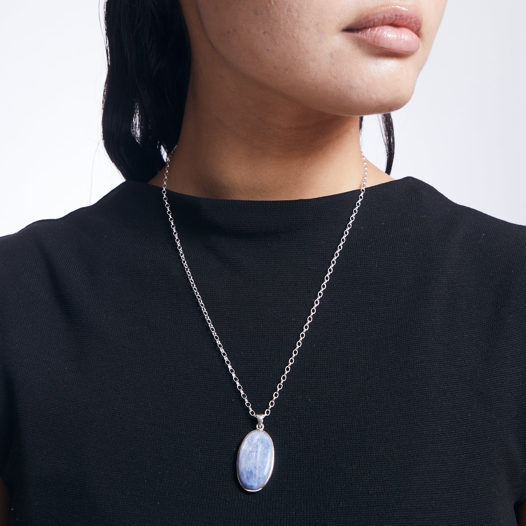 kyanite oval pendant with sterling silver chain on model