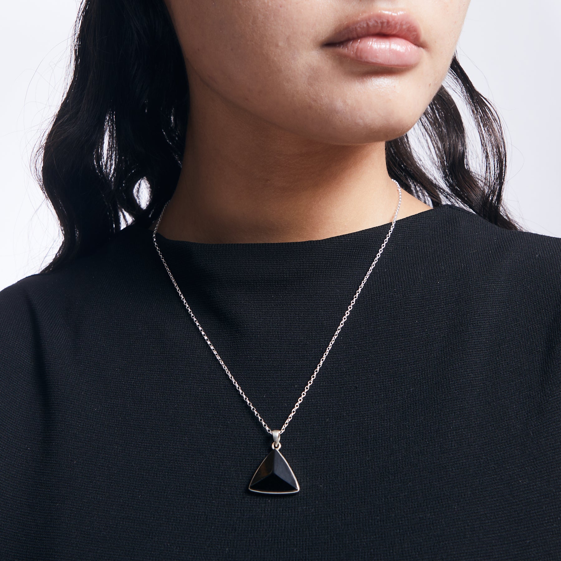 Black Tourmaline triangle faceted with sterling silver chain on model