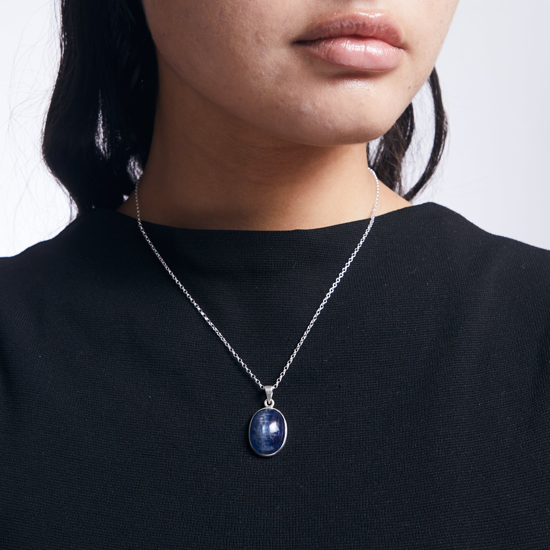 Oval Blue Kyanite from brazil with sterling silver chain on model