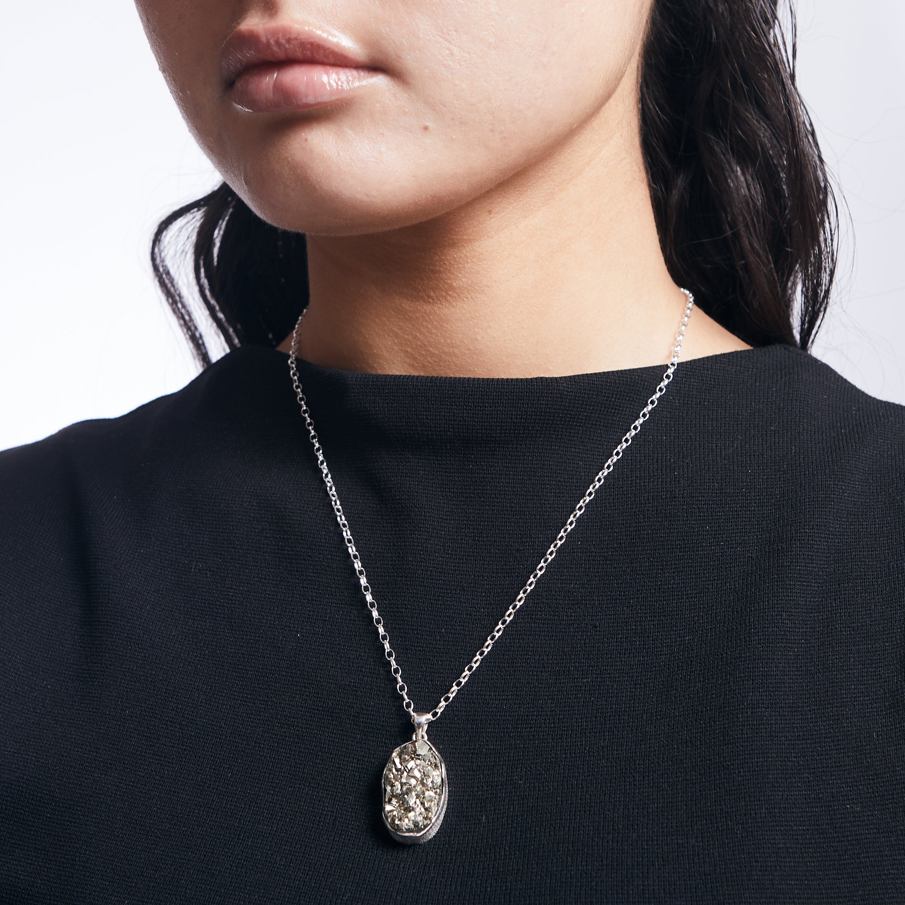 Pyrite cluster pendant freeform with sterling silver chain on model