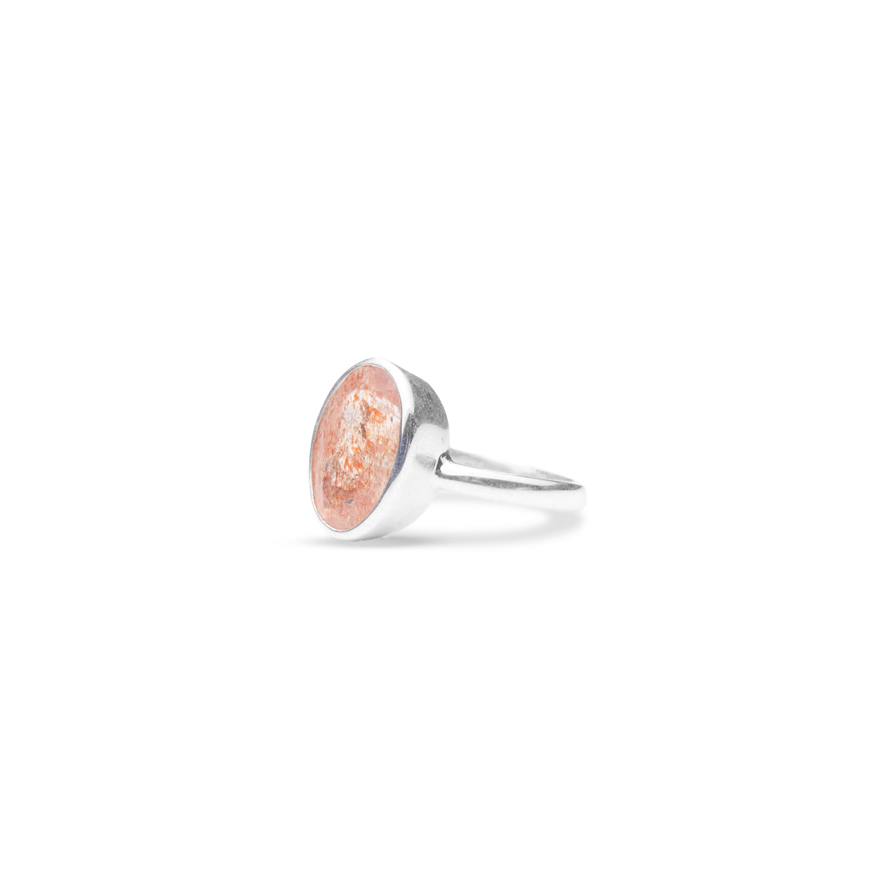 Sunstone faceted oval ring with thin band side angle