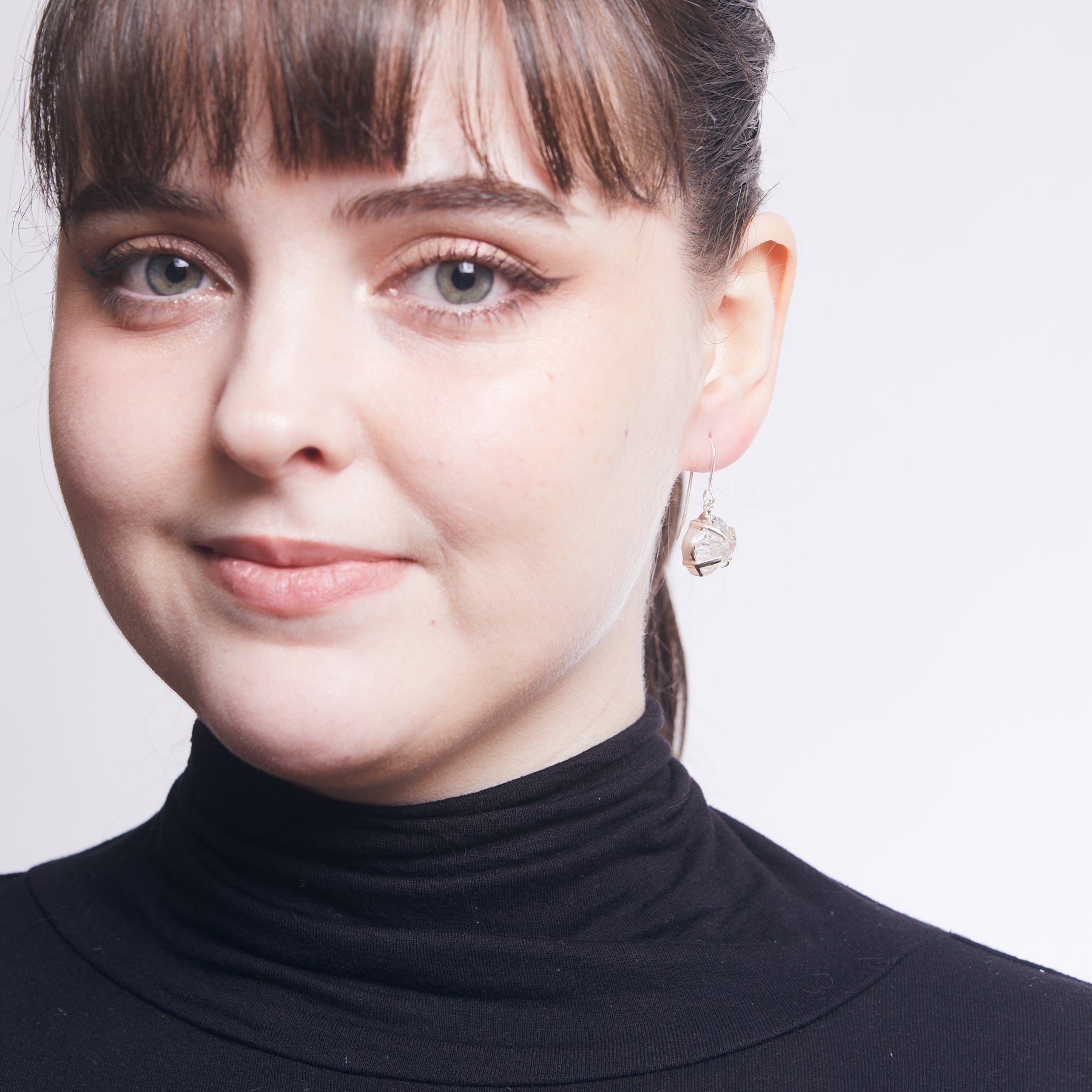 Herkimer Diamond freeform rough drop earrings with claw setting on model