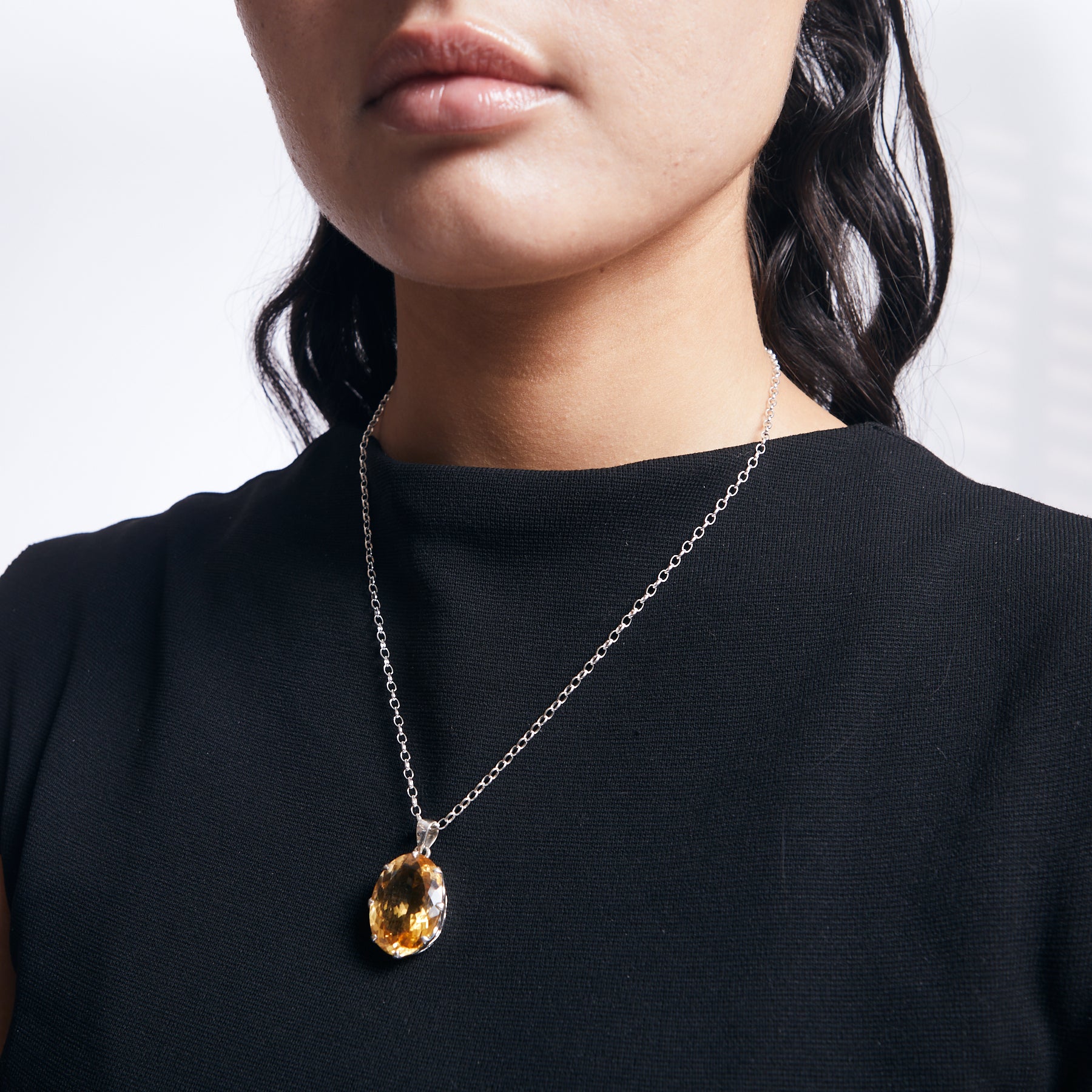 Citrine faceted pendant with sterling silver chain on model