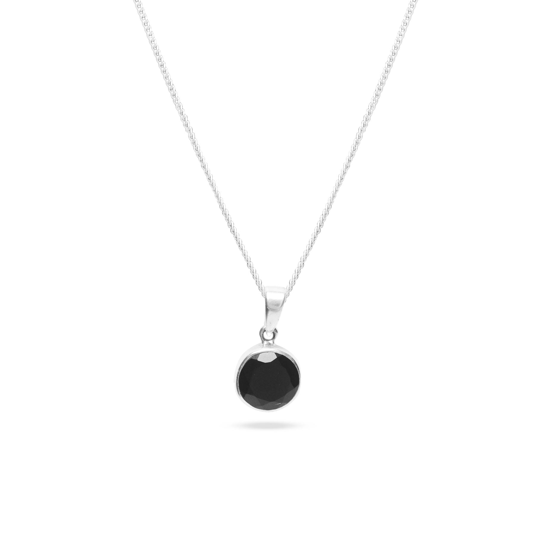 Black onyx pendant with faceted finish and sterling silver bezel 