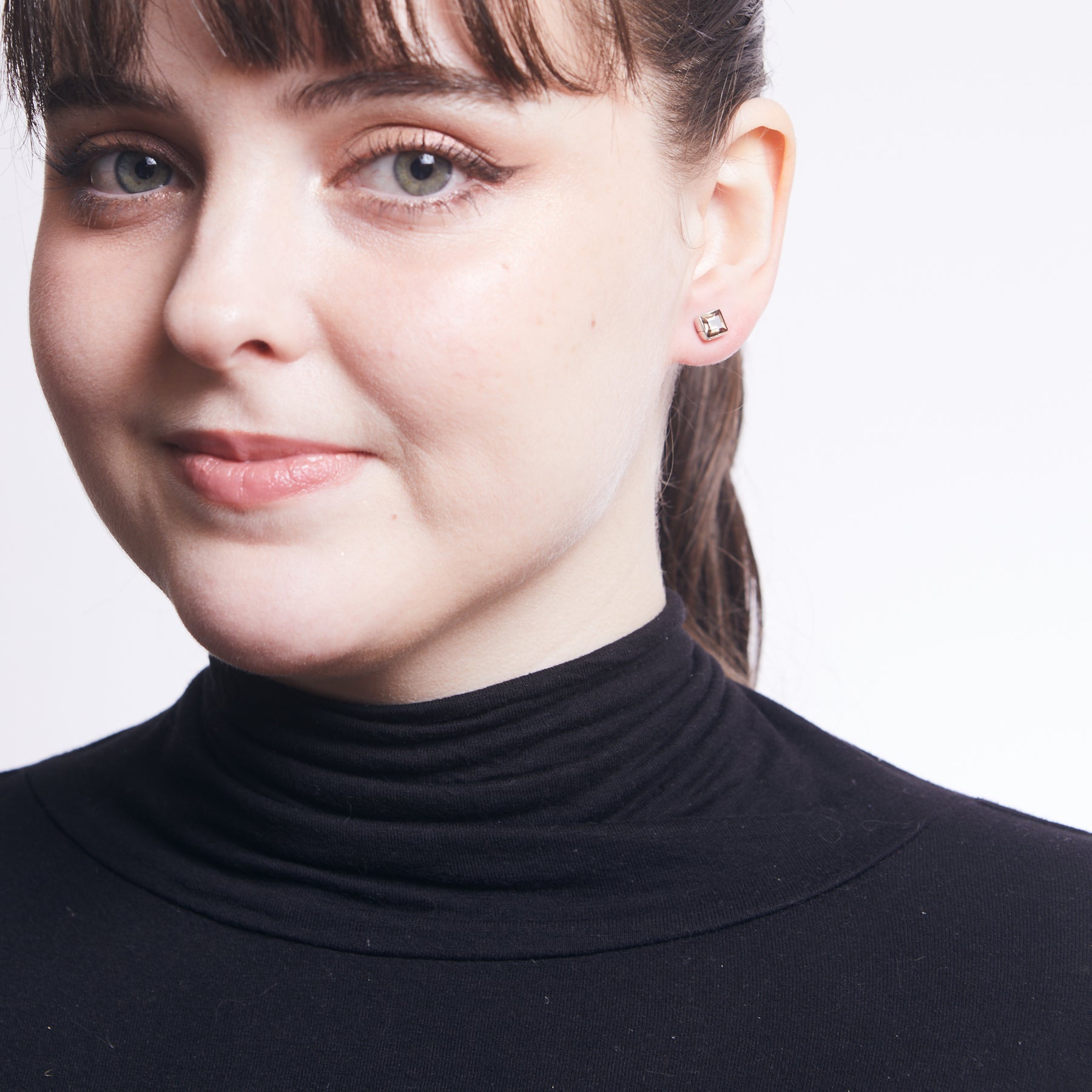 Smokey Quartz faceted square stud earrings with bezel setting on model