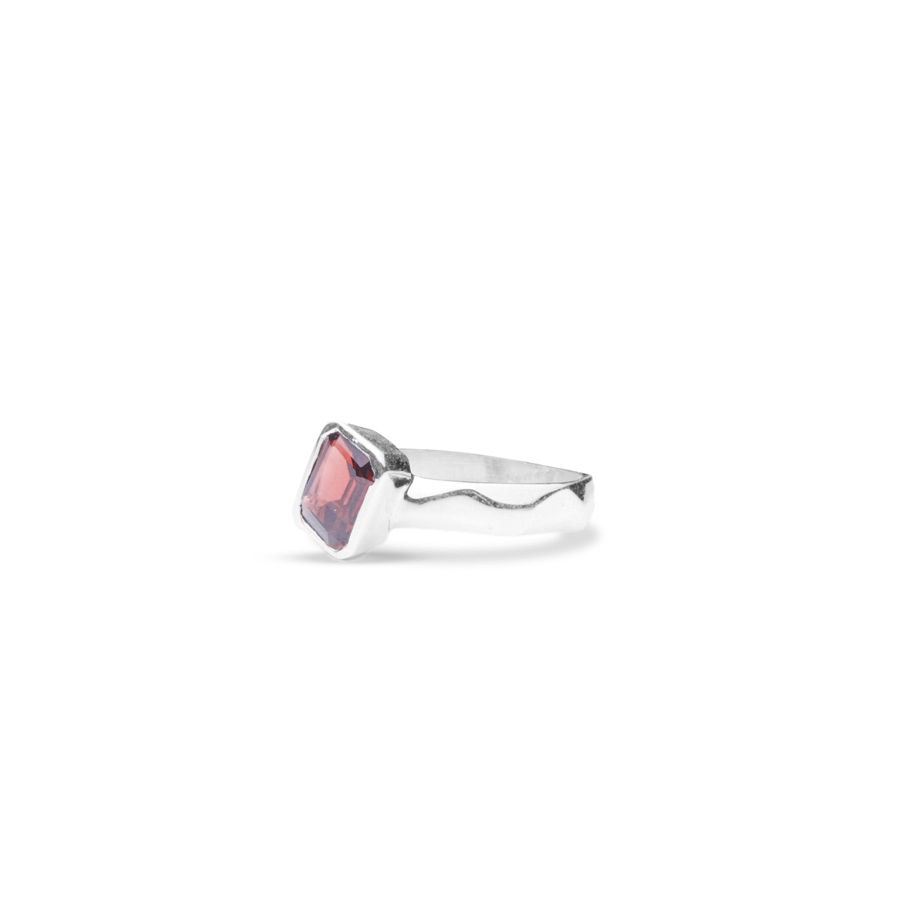 Garnet rectangle cushion ring offset with diamond cut band front angle 