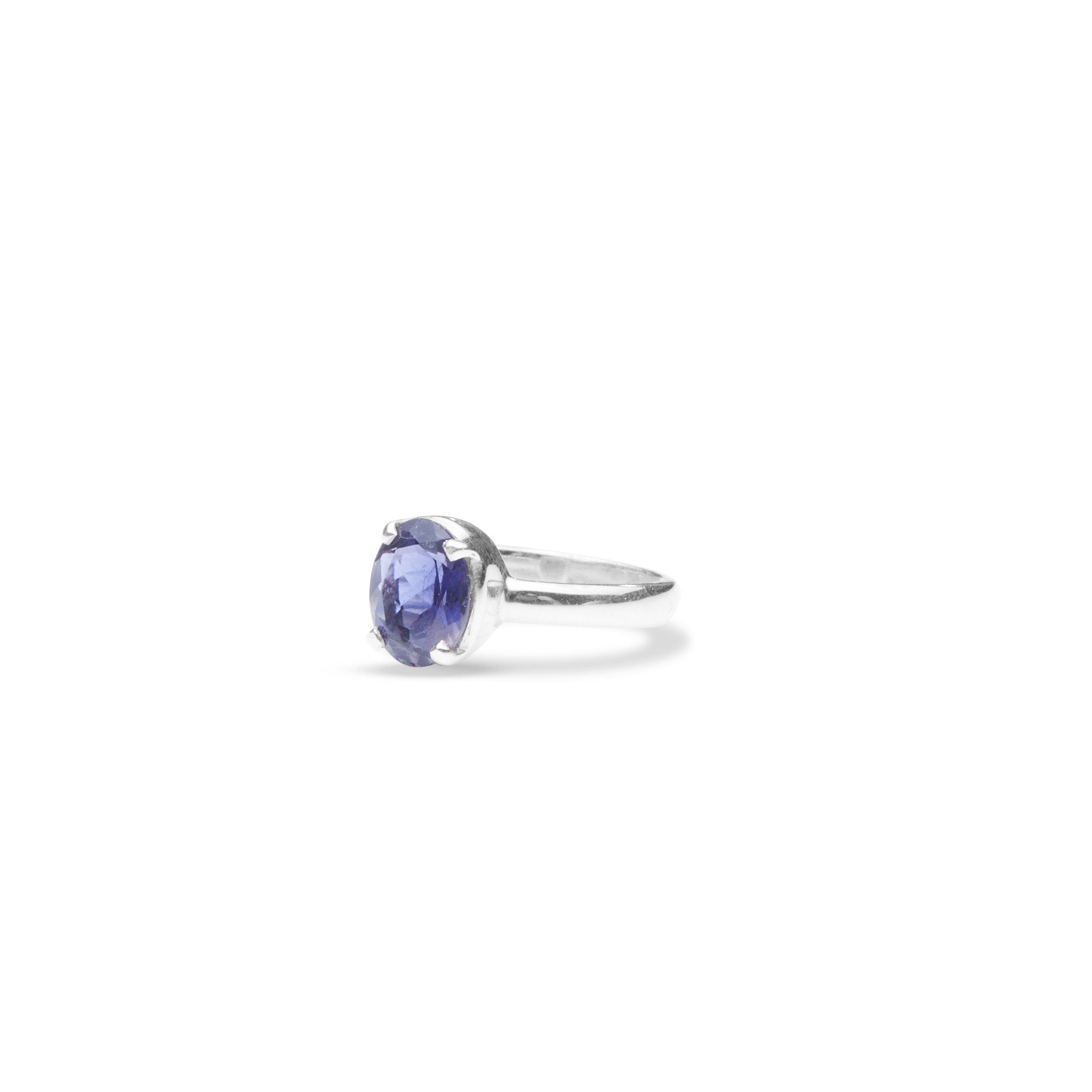 Iolite oval faceted ring with thin band and claws