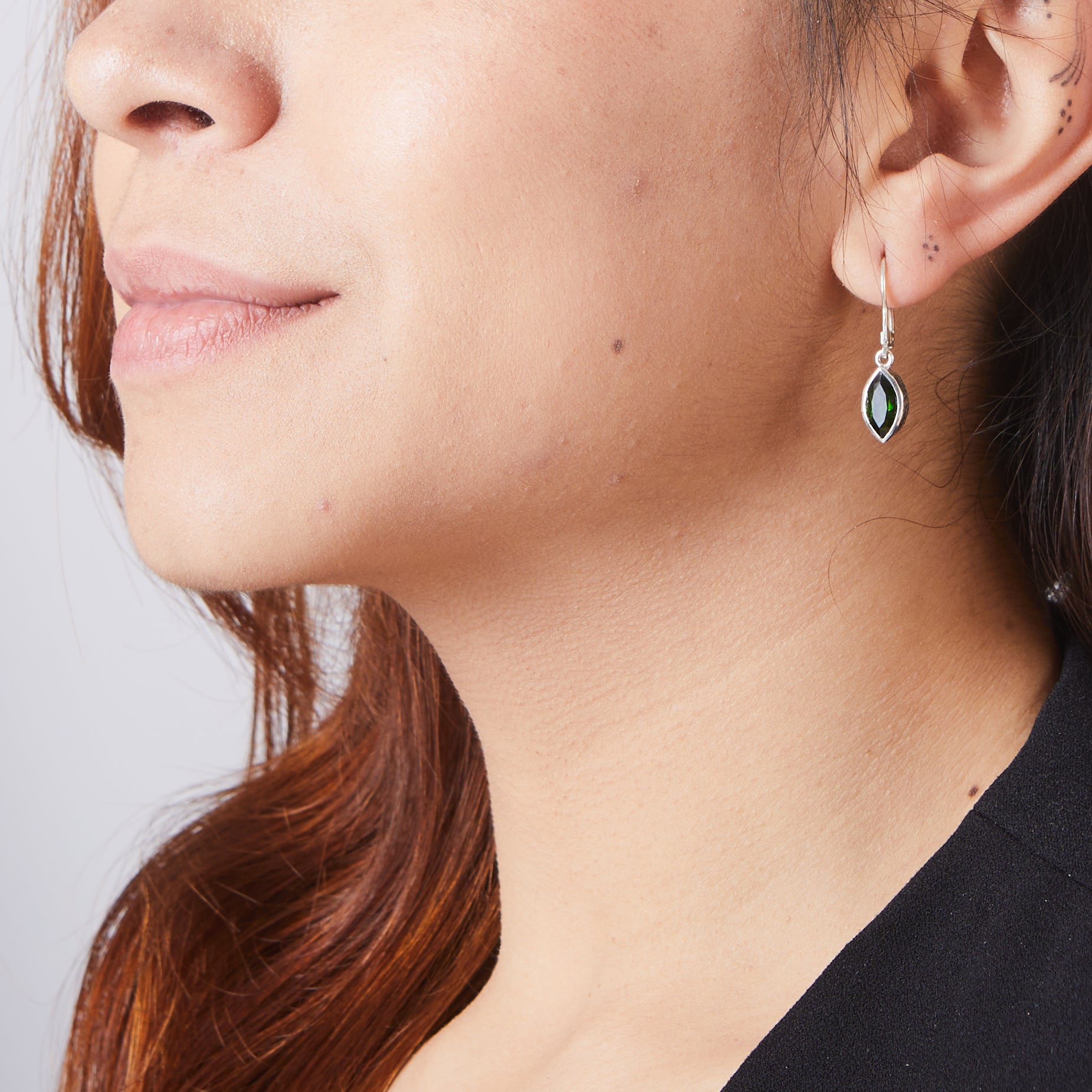 Chrome diopside marquise drop earrings on model