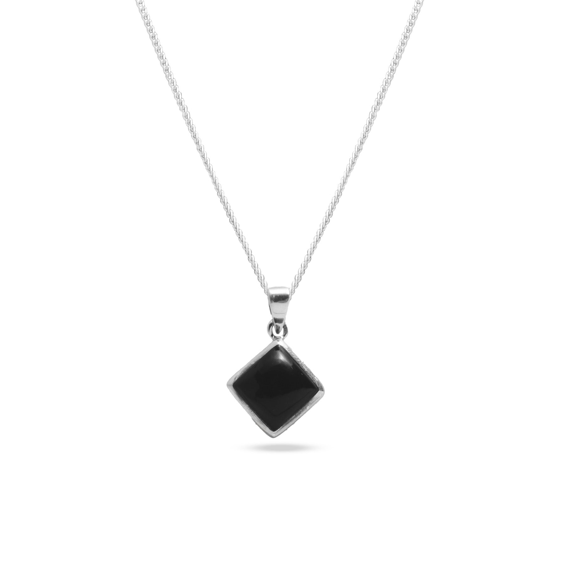 Black onyx cabochon diamond set pendant 