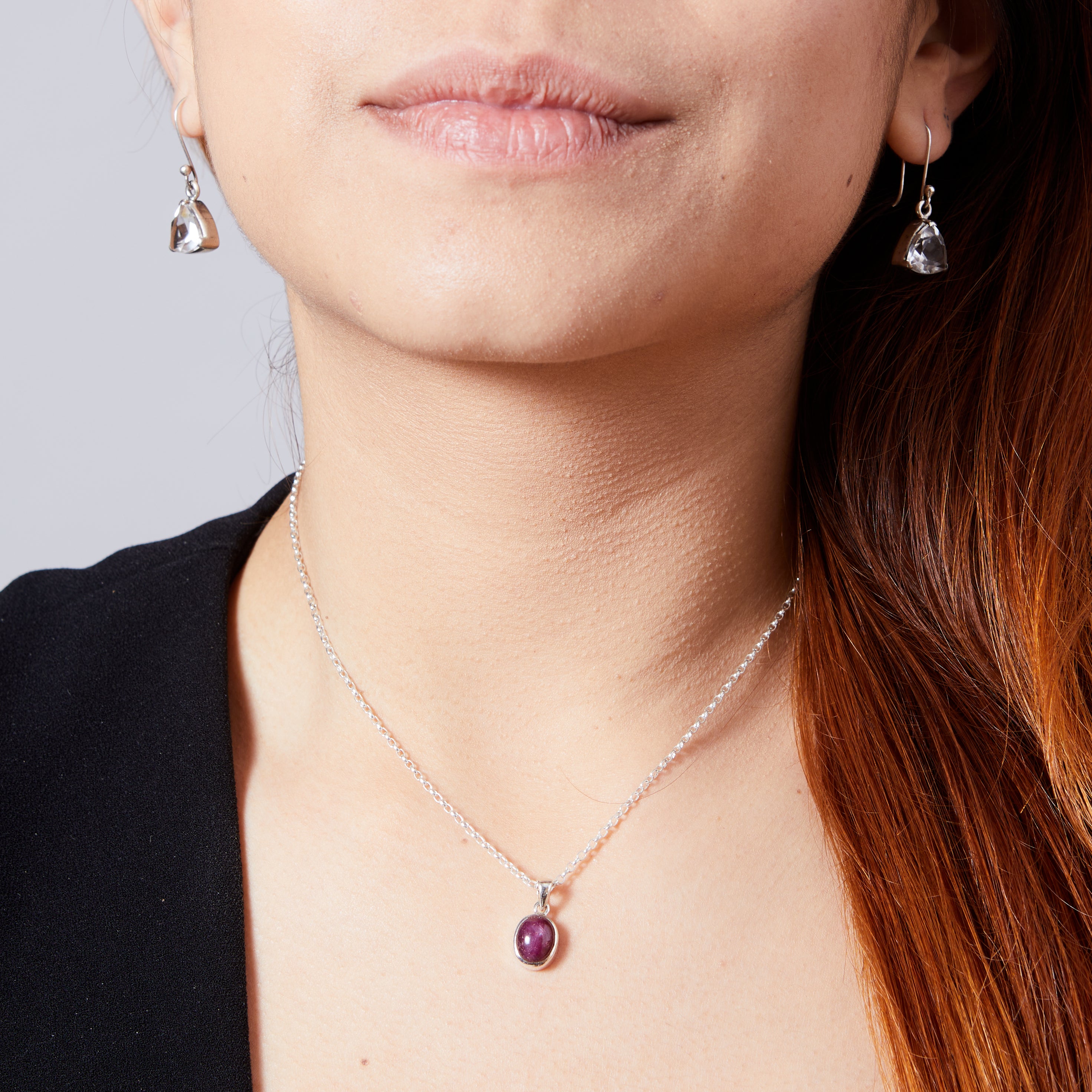 Star Ruby oval cabochon bezel set pendant on model