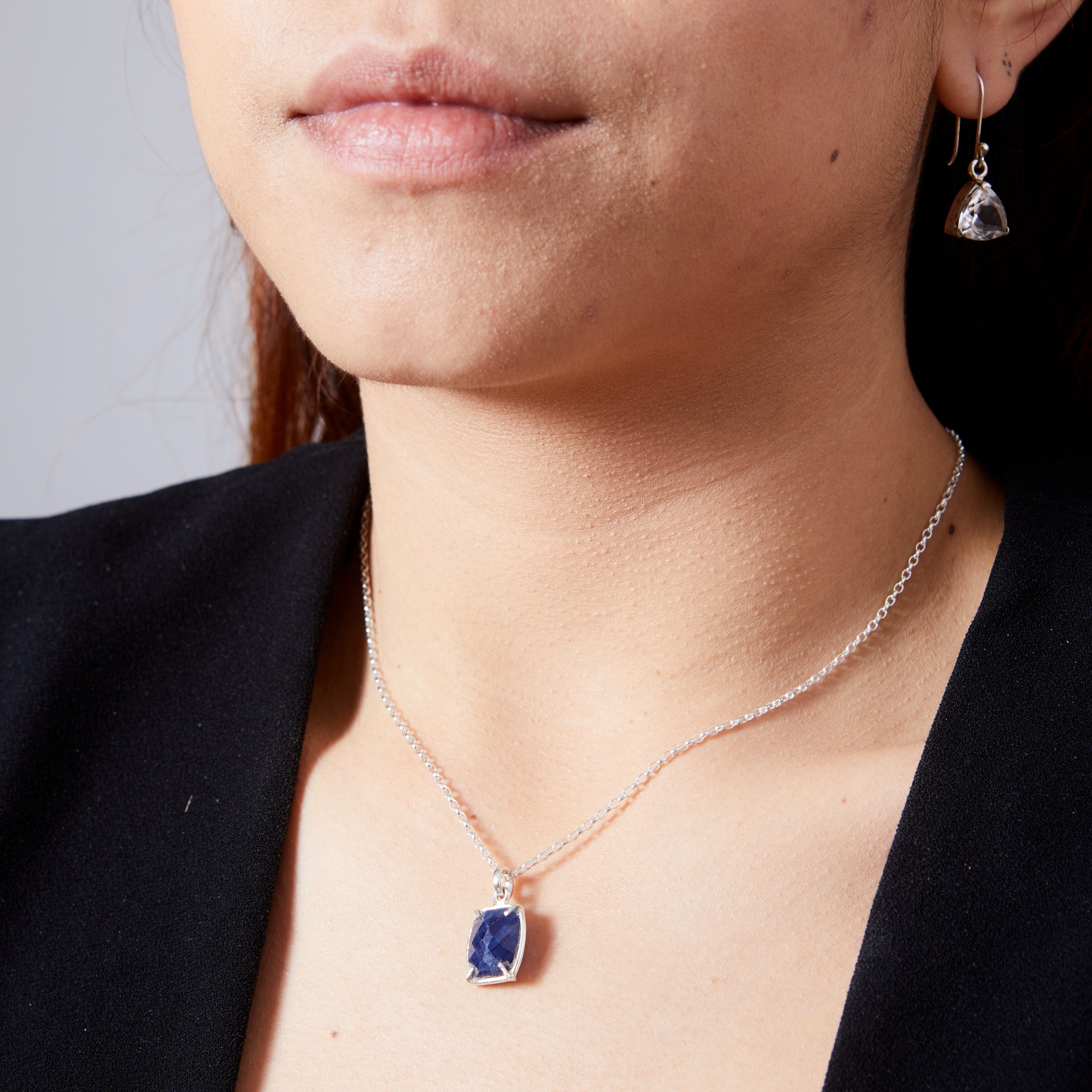 Sapphire rectangle cushion checkerboard faceted claw set pendant  on model