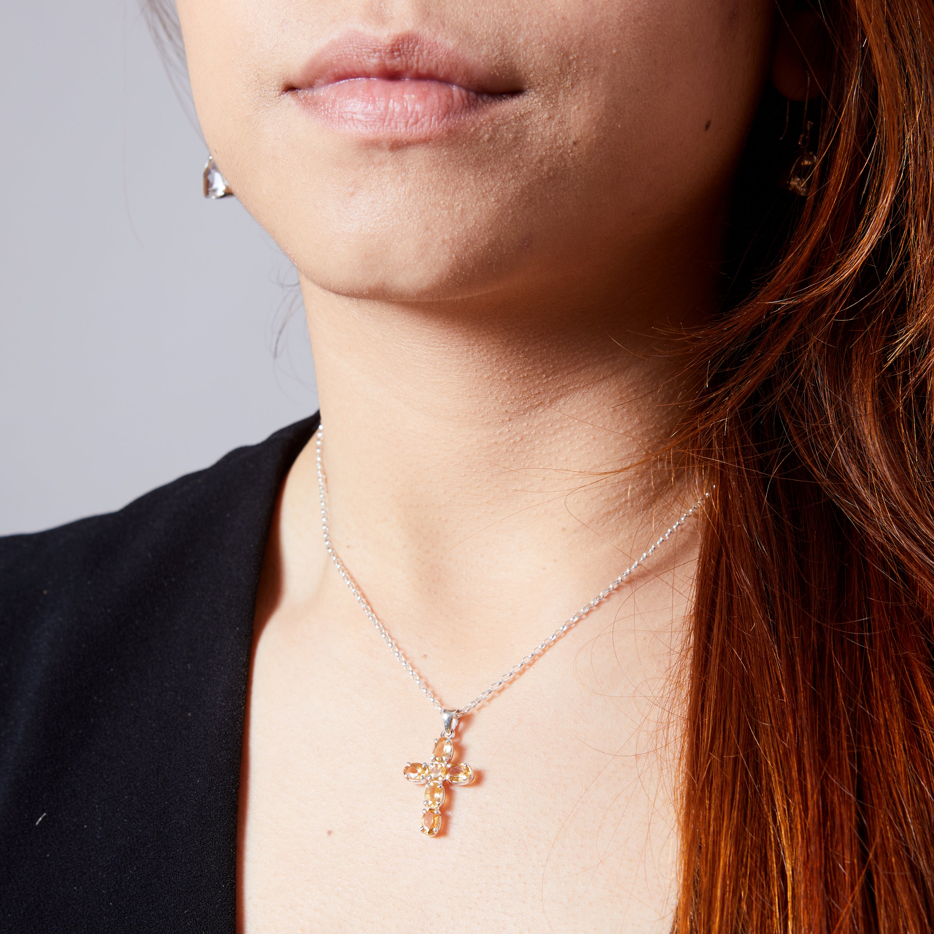 Citrine faceted claw set cross on model