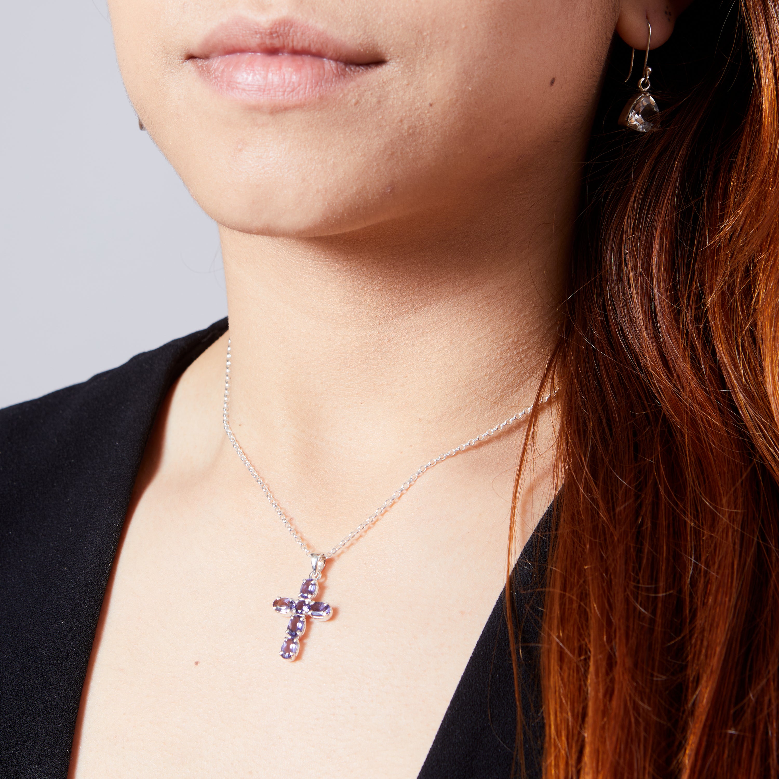 iolite faceted claw set cross on model