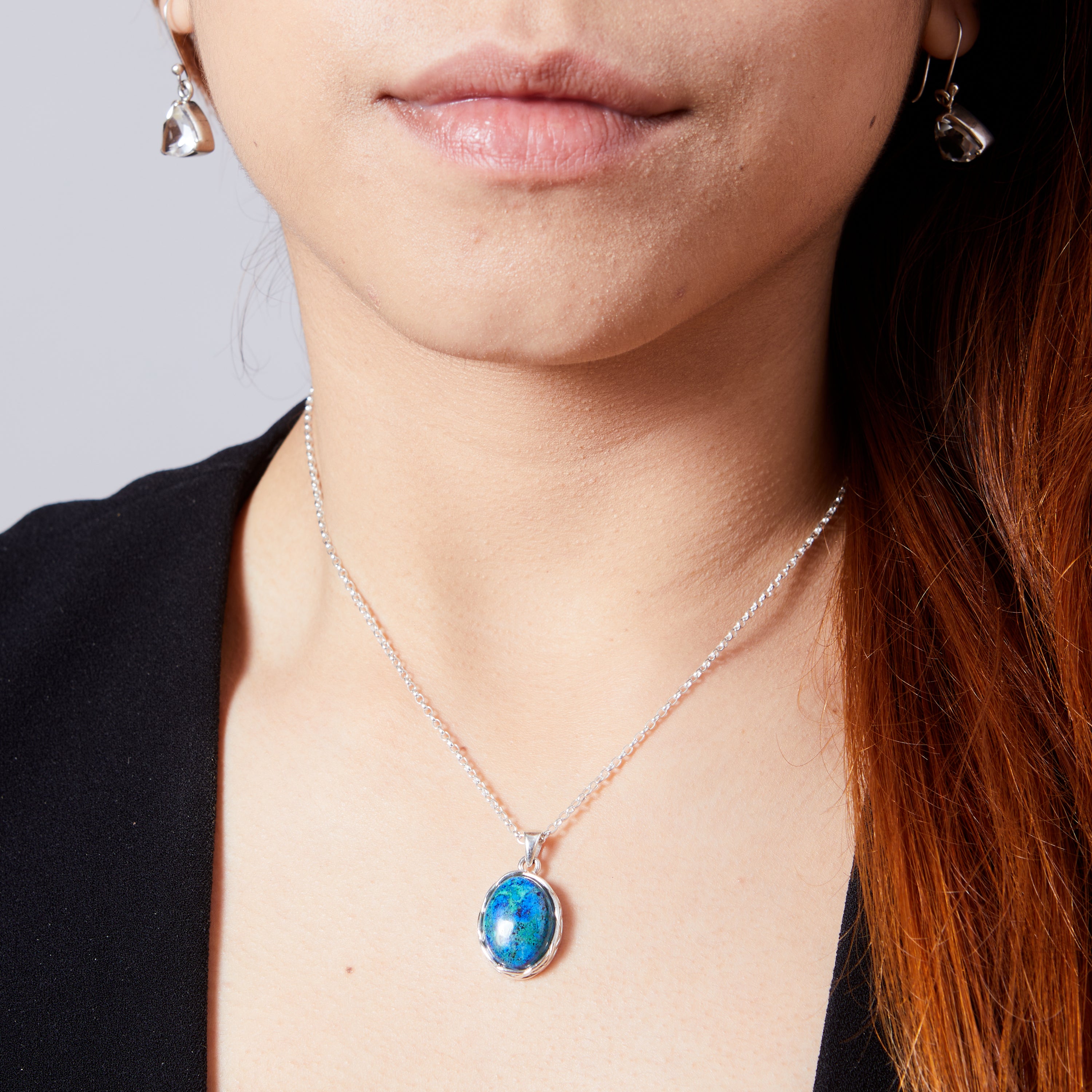 Azurite Malachite cabochon oval pendant with braided bezel on model