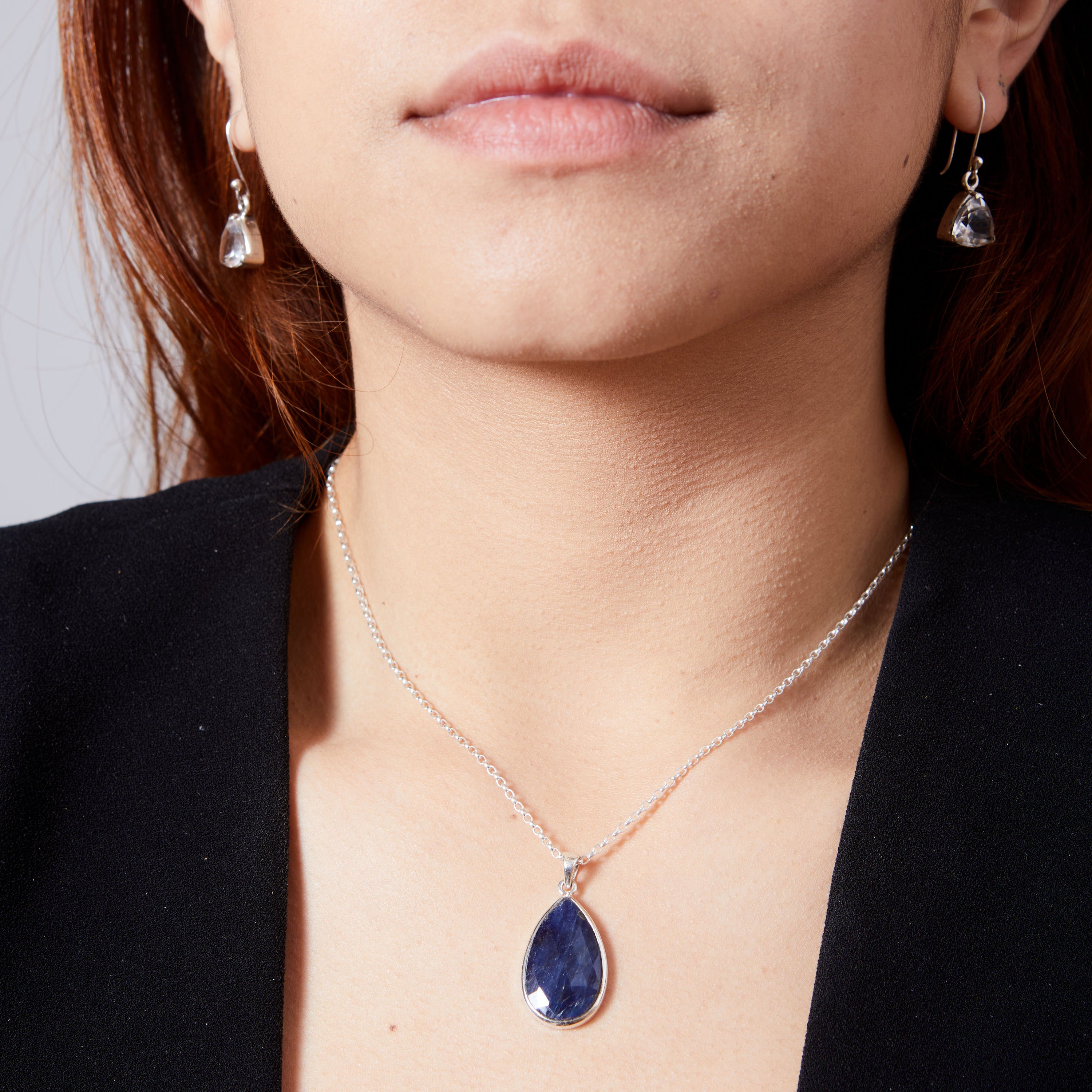 Sapphire faceted checkerboard teardrop with bezel setting pendant  on model