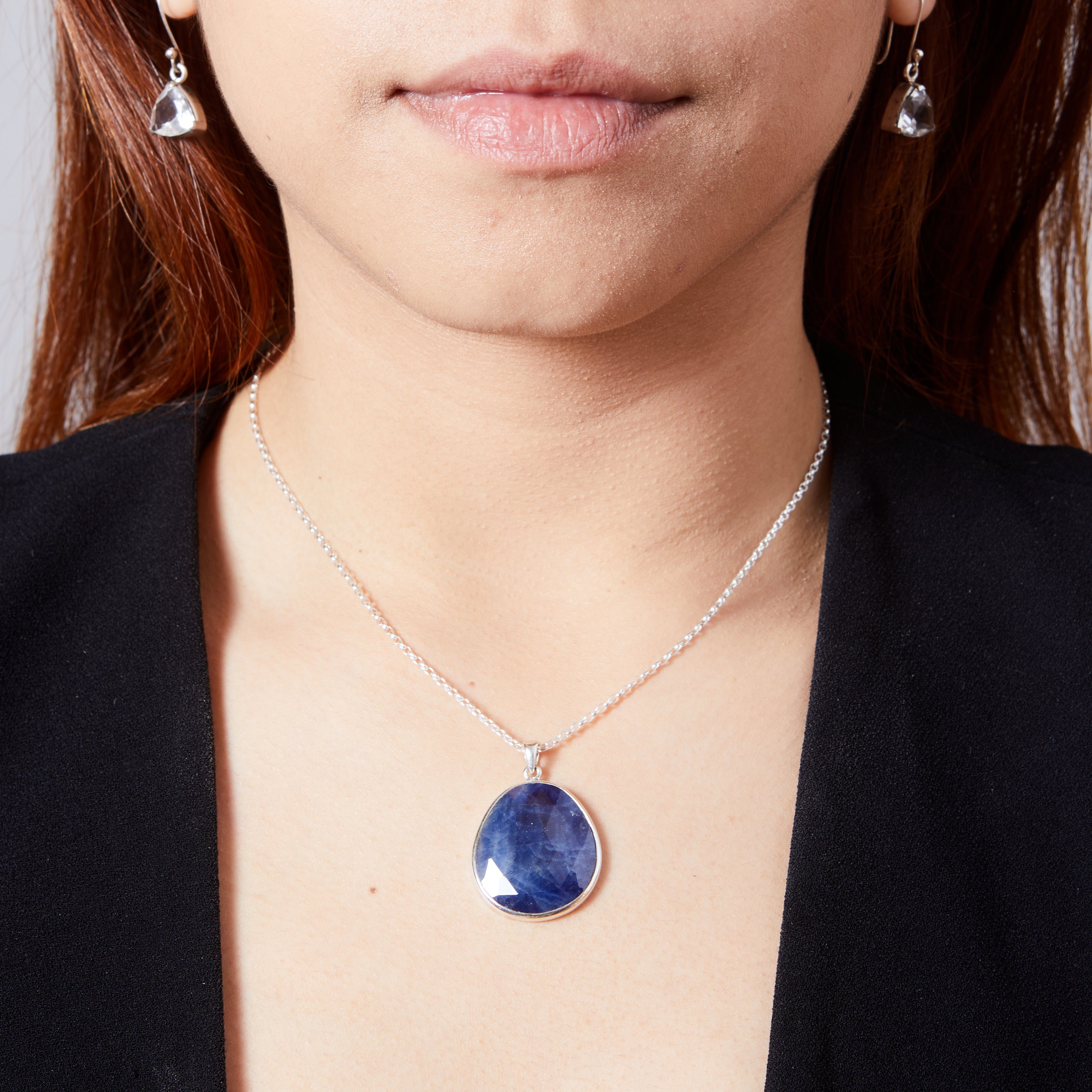 Sapphire faceted checker board freeform with bezel setting pendant on model