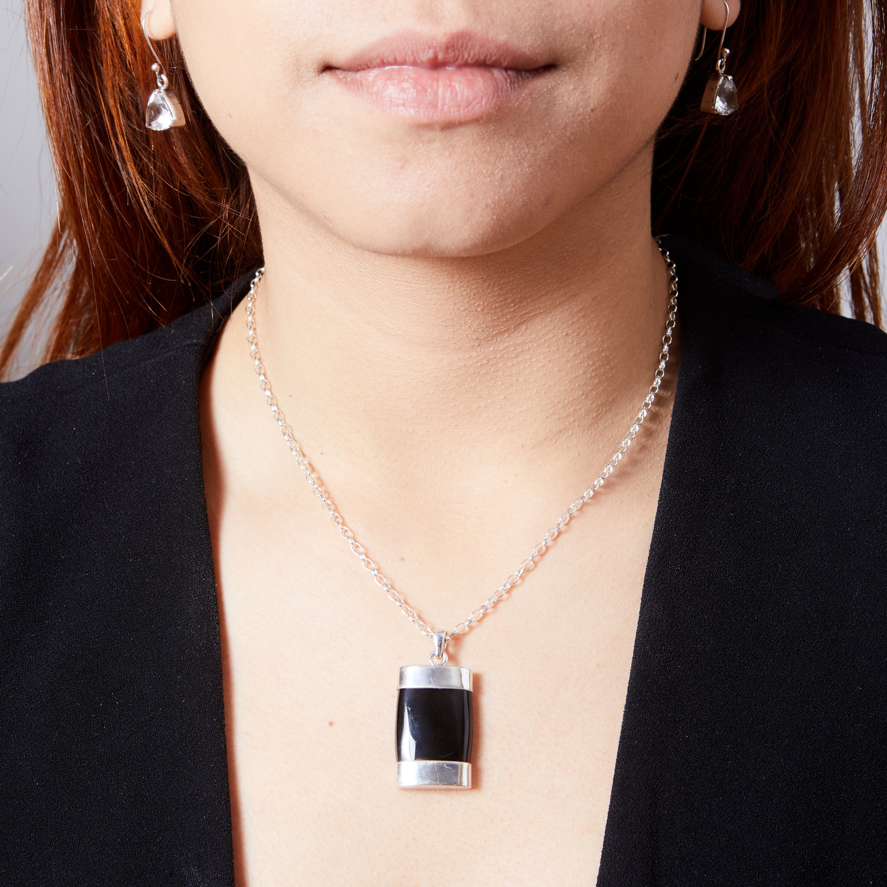 Black Onyx cabachon rectangle pencil with top and bottom cap pendant  on model 