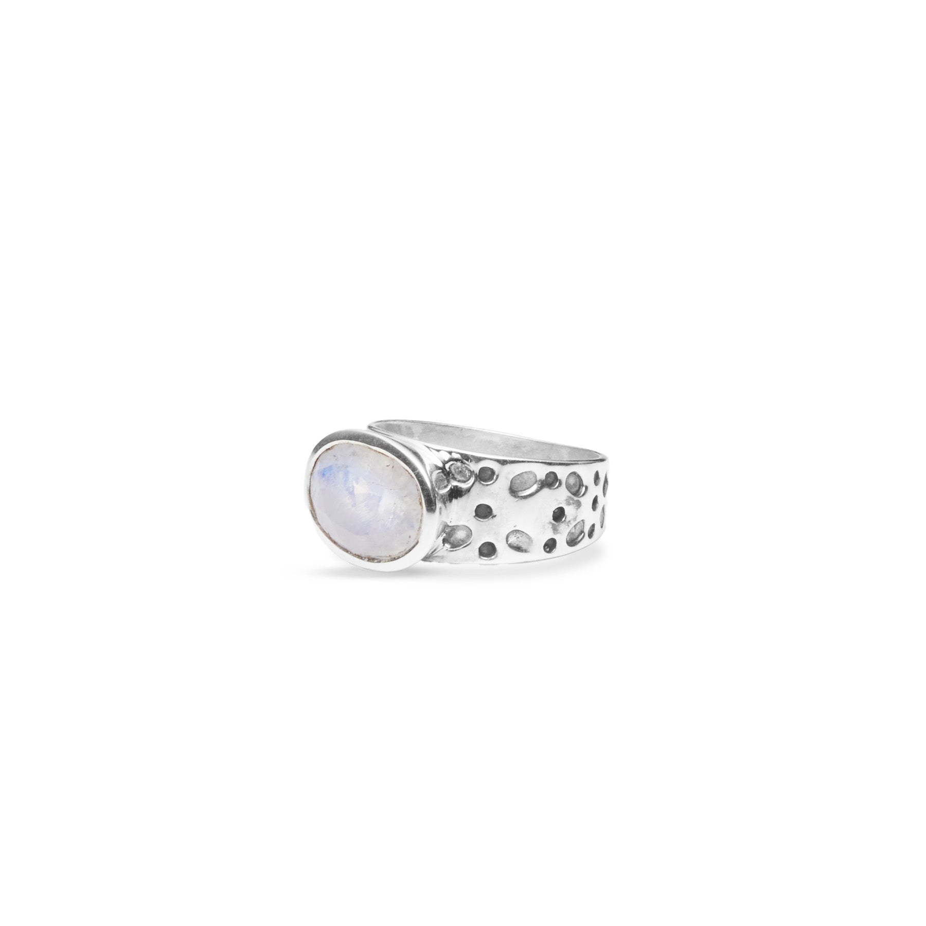 Rainbow Moonstone oval faceted bezel set ring with dot textured band side angle