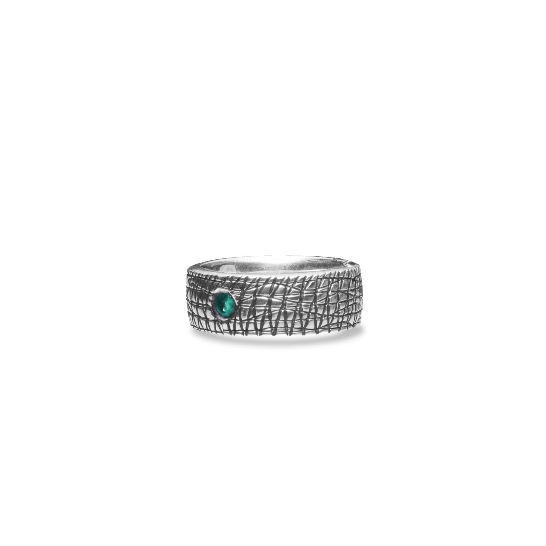 Emerald and sterling silver ring with thick textured band side angle