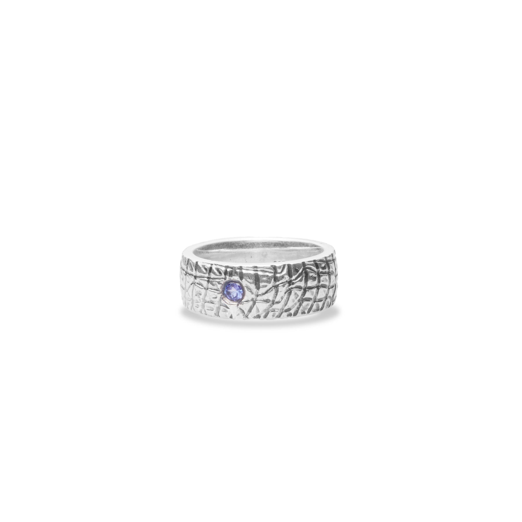 Tanzanite round faceted ring with sterling silver textured band side angle