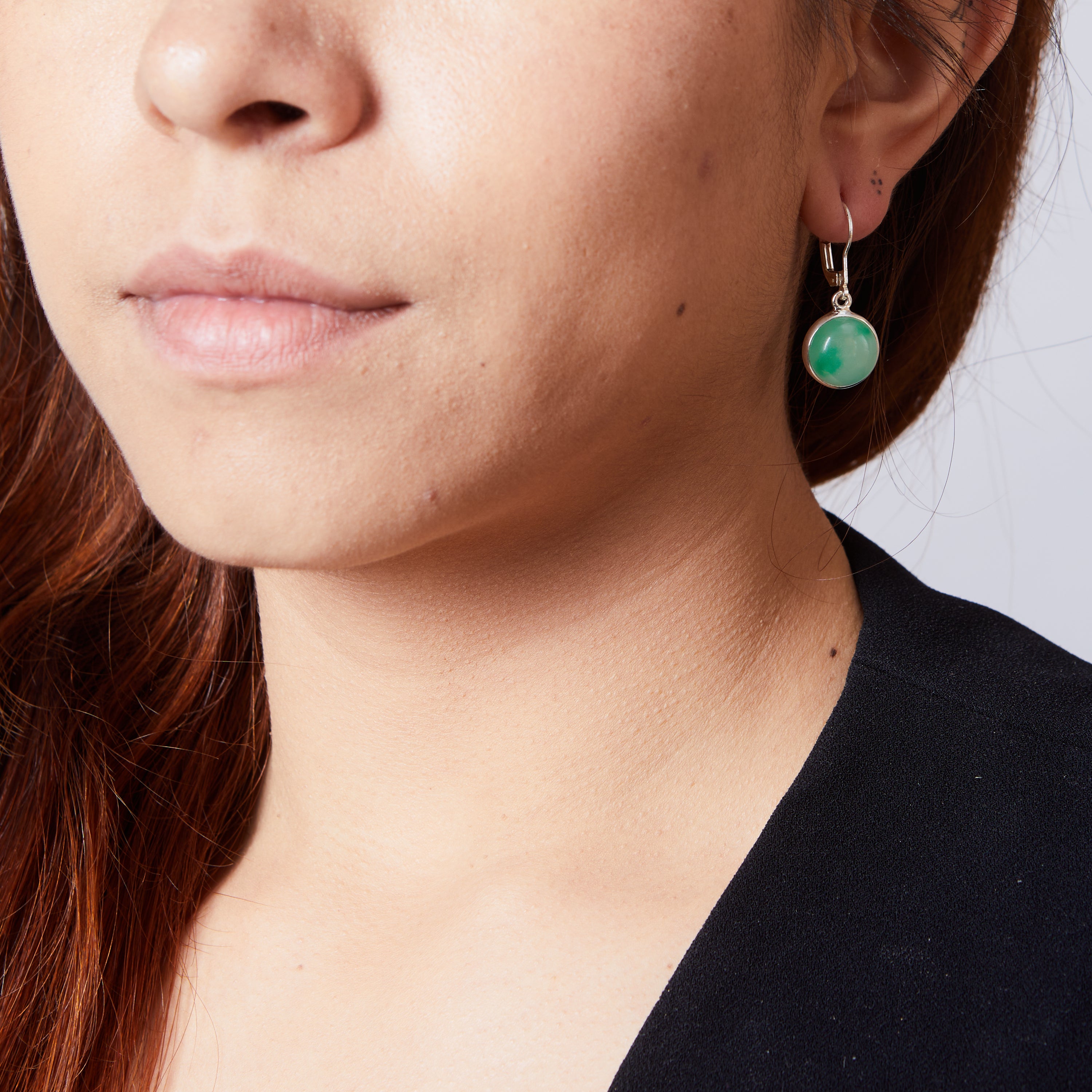 Jadeite round cabochon clasp drop earrings on model