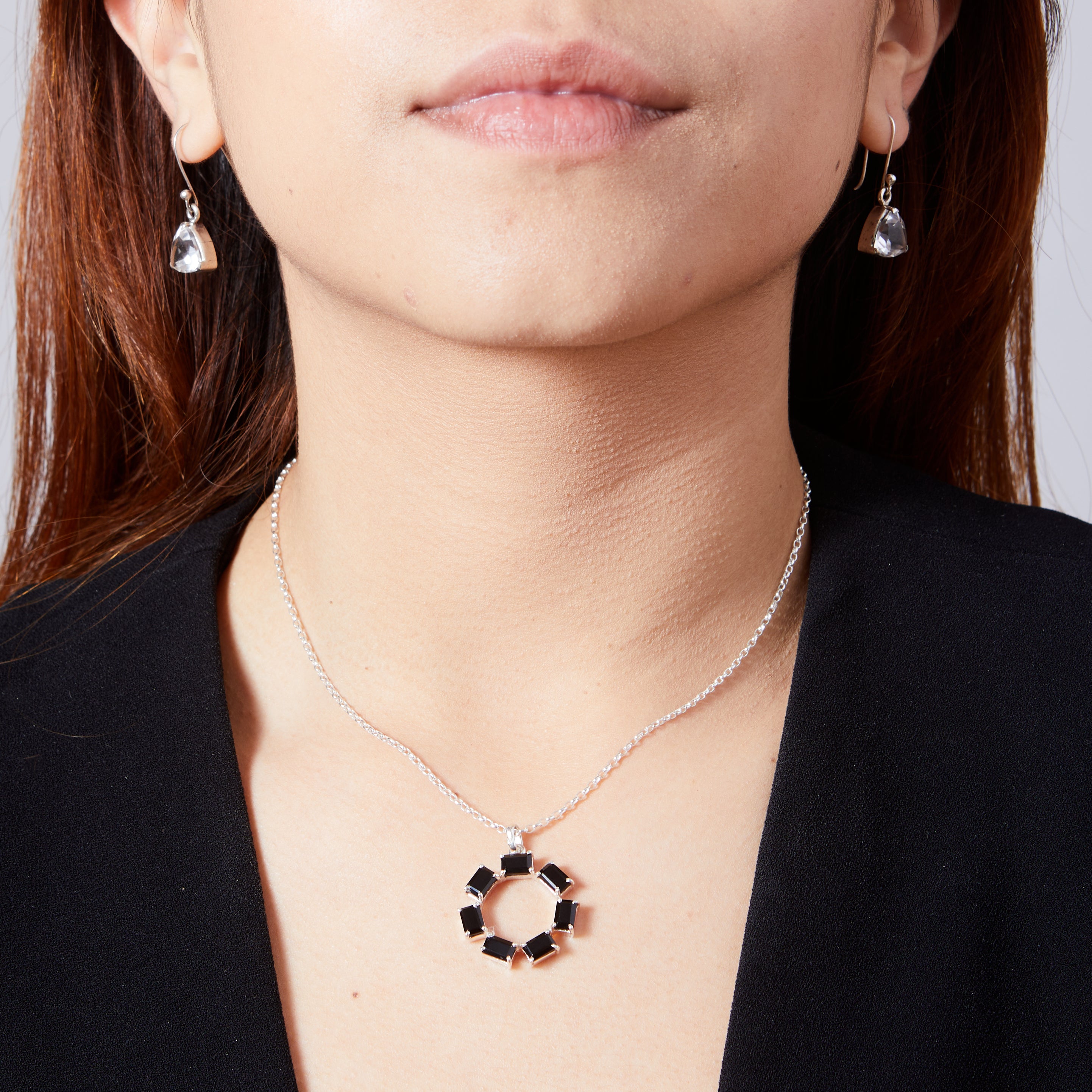 Black Onyx rectangle faceted claw set round pendant on model