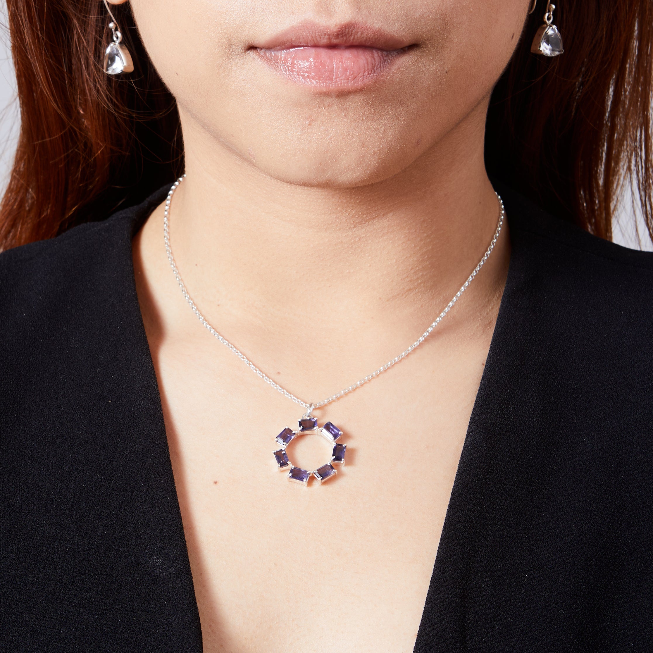 iolite rectangle faceted claw set round pendant on model