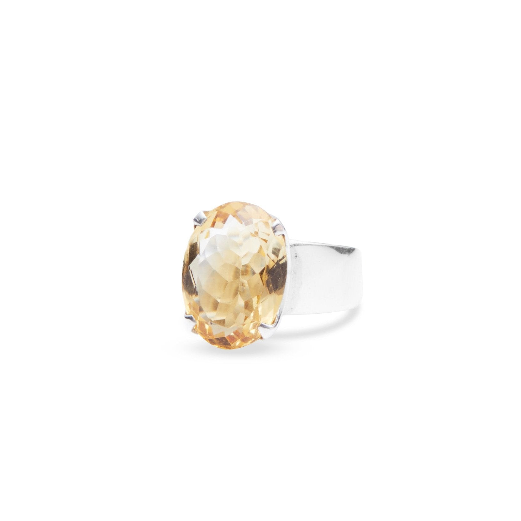 Citrine oval laser cut facet with sterling silver claw bezel on thick band 