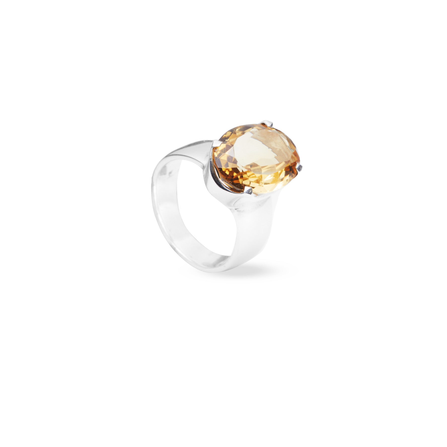 Citrine oval laser cut facet with sterling silver claw bezel on thick band side angle