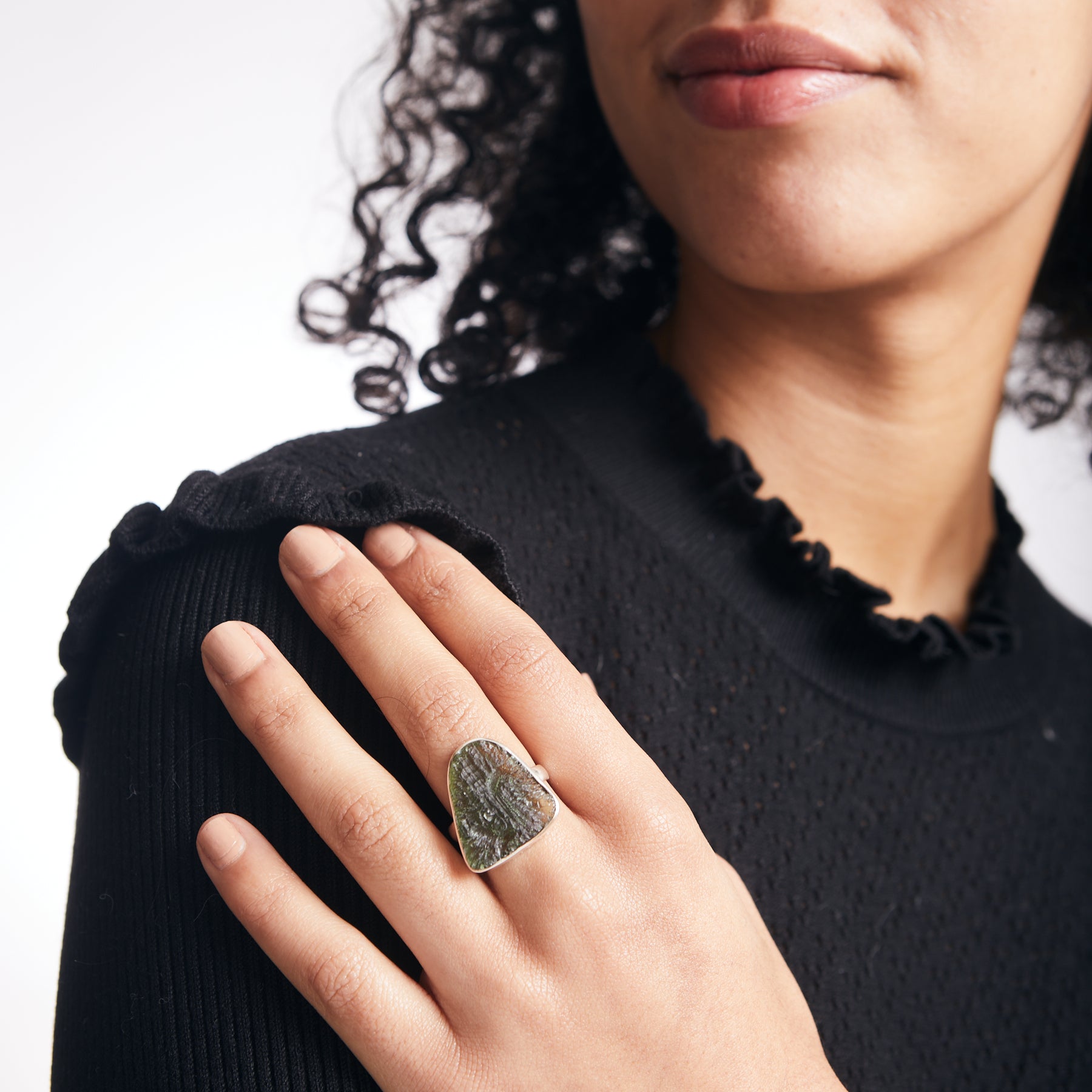 Moldavite freeform rough sterling silver ring on model