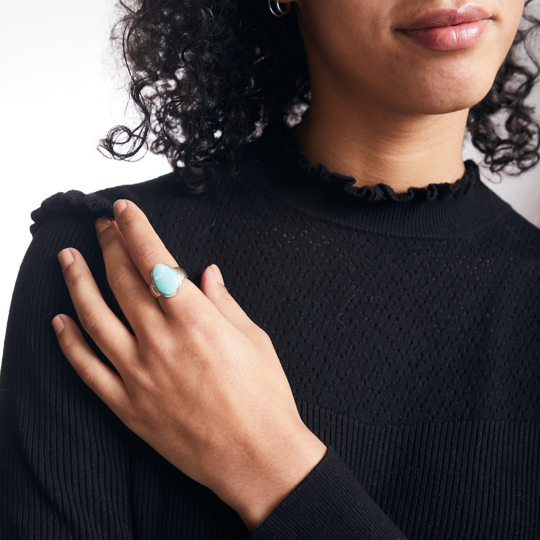 Ammaroo Turquoise freeform ring with thick sterling silver band on model