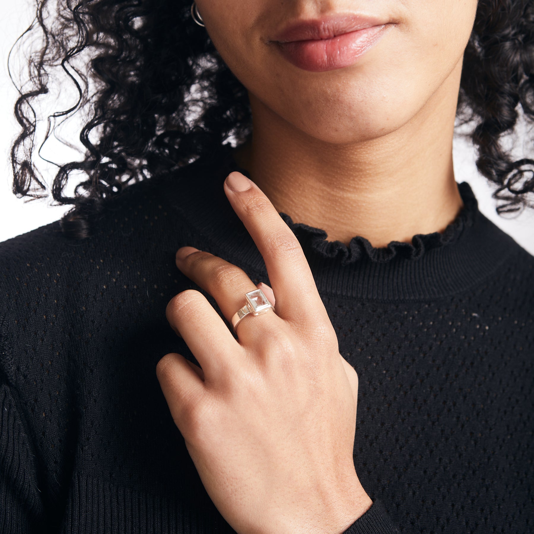 Tourmalinated quartz ring with rectangle faceted cut and filigree basket setting on model