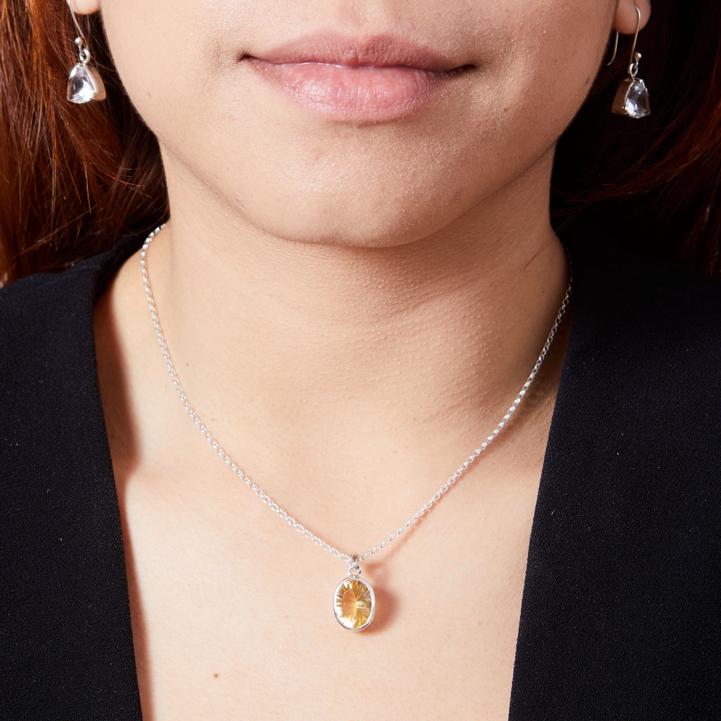 Citrine Oval Facet with bezel set on model