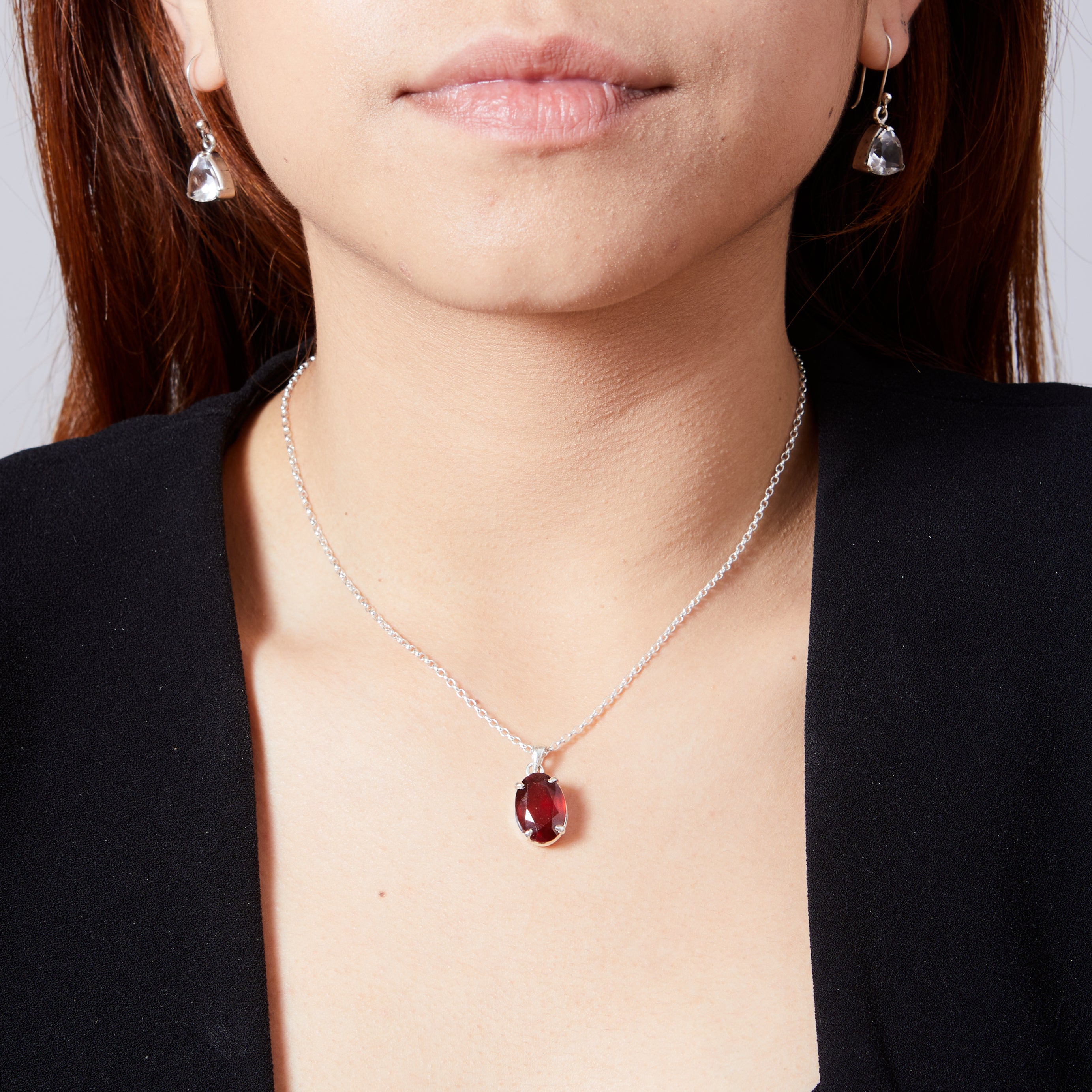 Garnet oval faceted pendant with claws on model