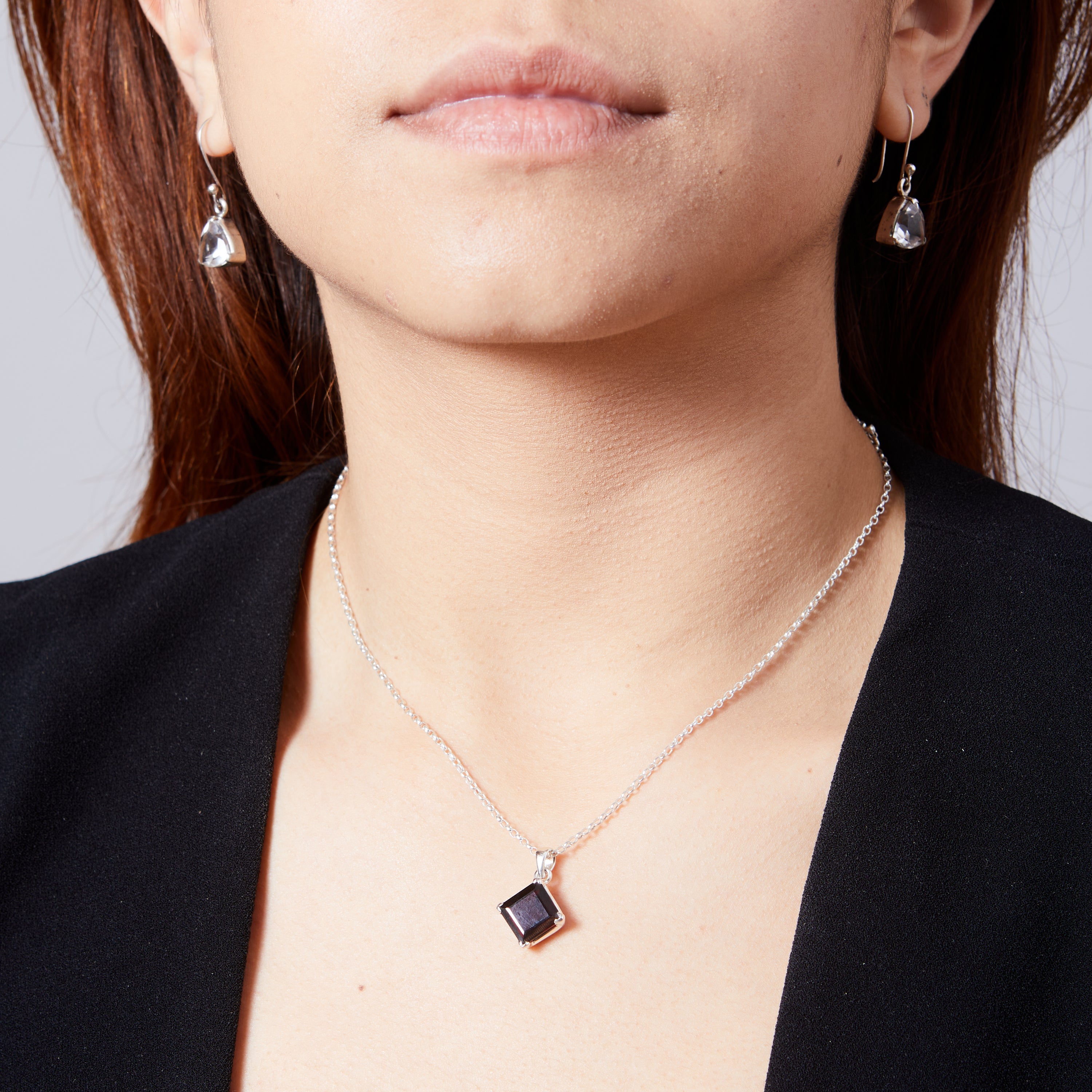 Garnet square diamond set faceted pendant with clamp setting on model