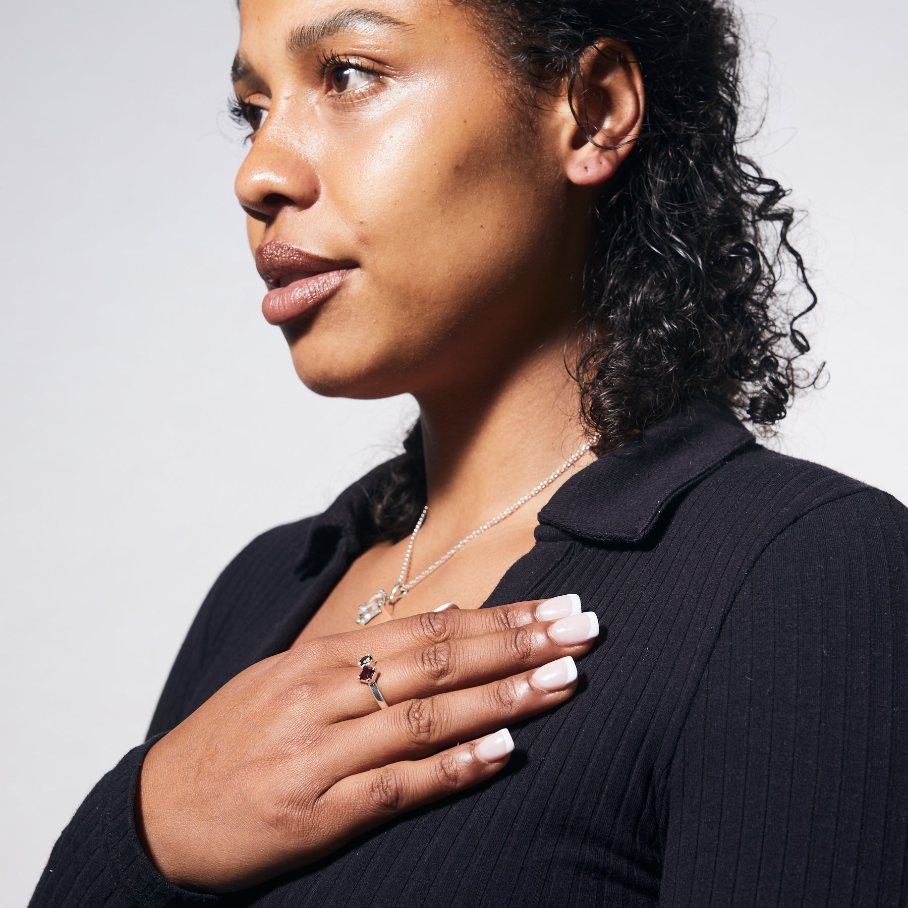 Garnet square and smokey quartz round faceted claw set ring on model