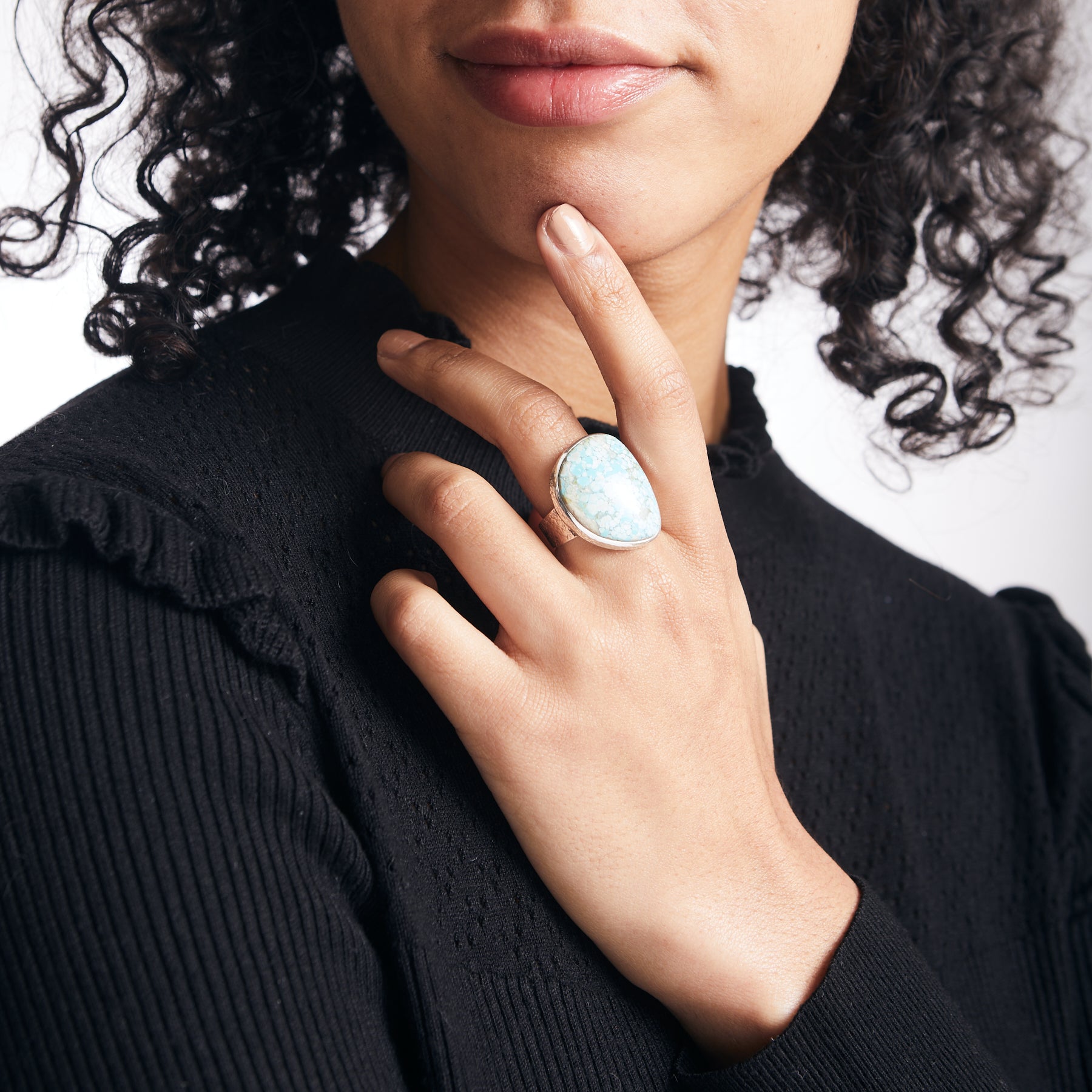 Ammaroo Turquoise freeform ring with hammered band on model