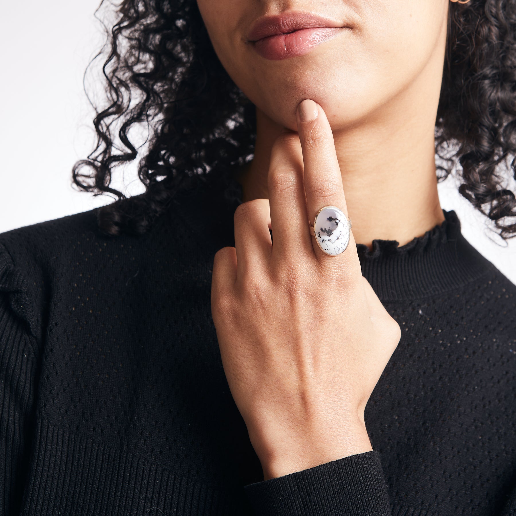 Oval Dendritic opal with hammered bezel and band on model