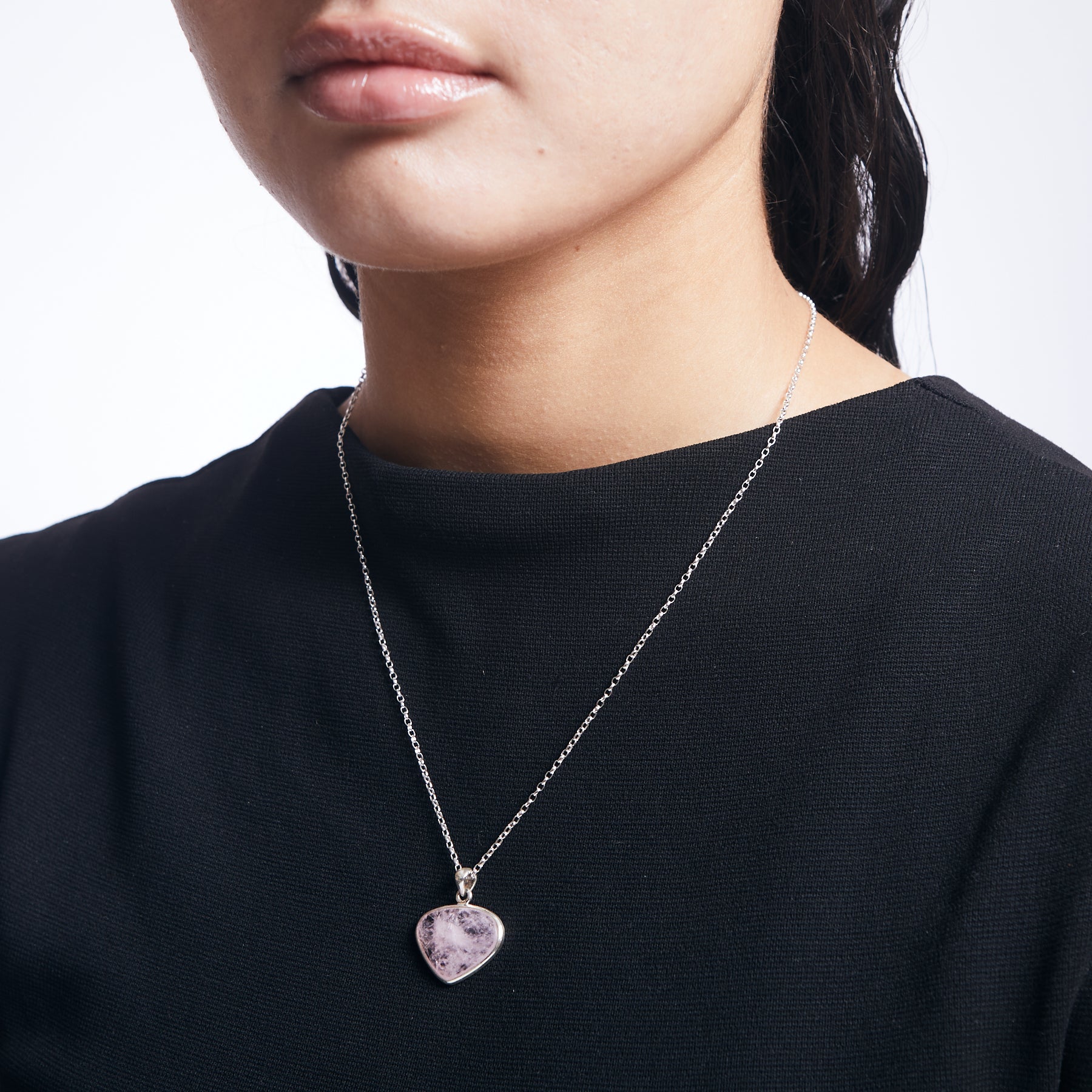 Morganite freeform pendant with sterling silver chain on model