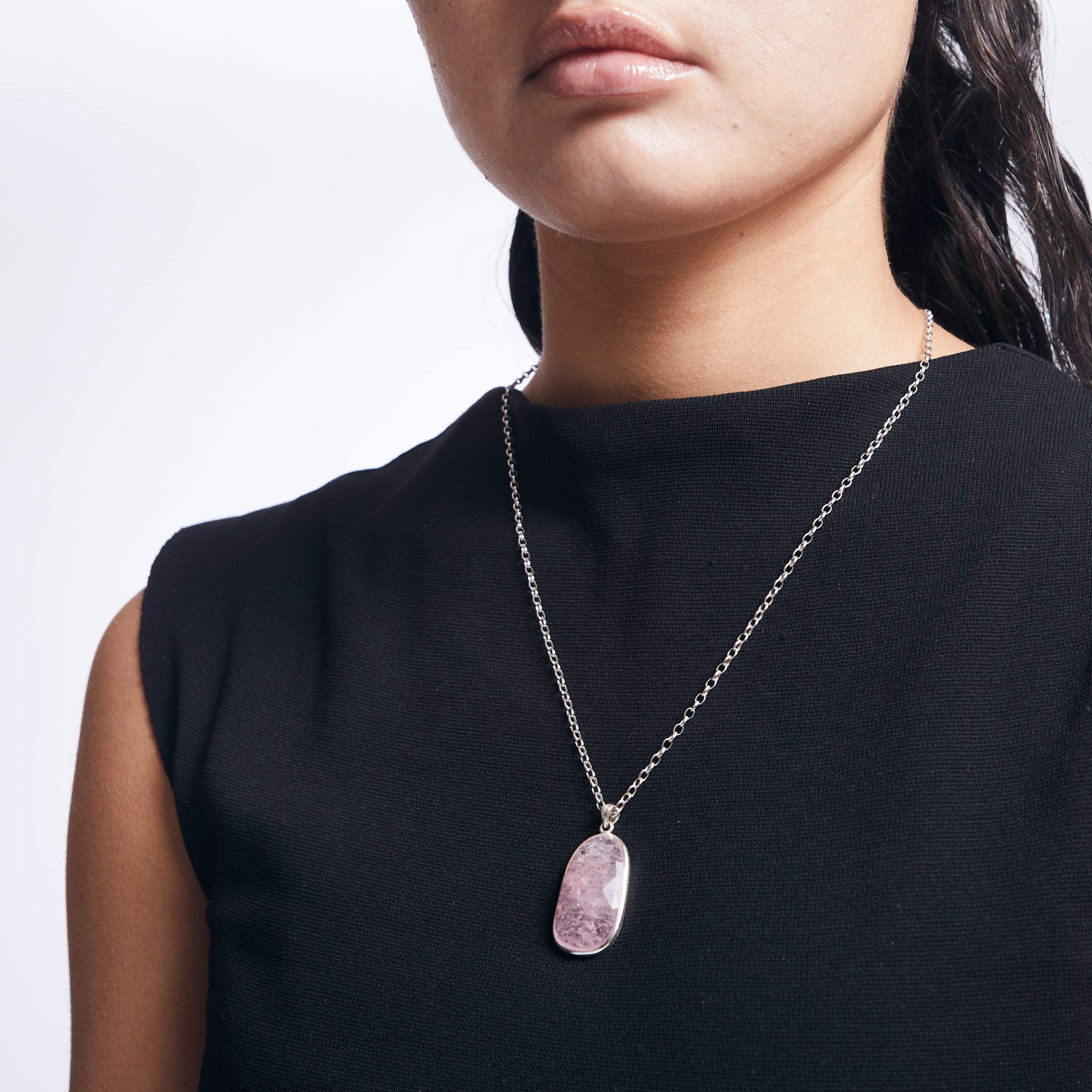 Morganite freeform pendant with sterling silver chain on model