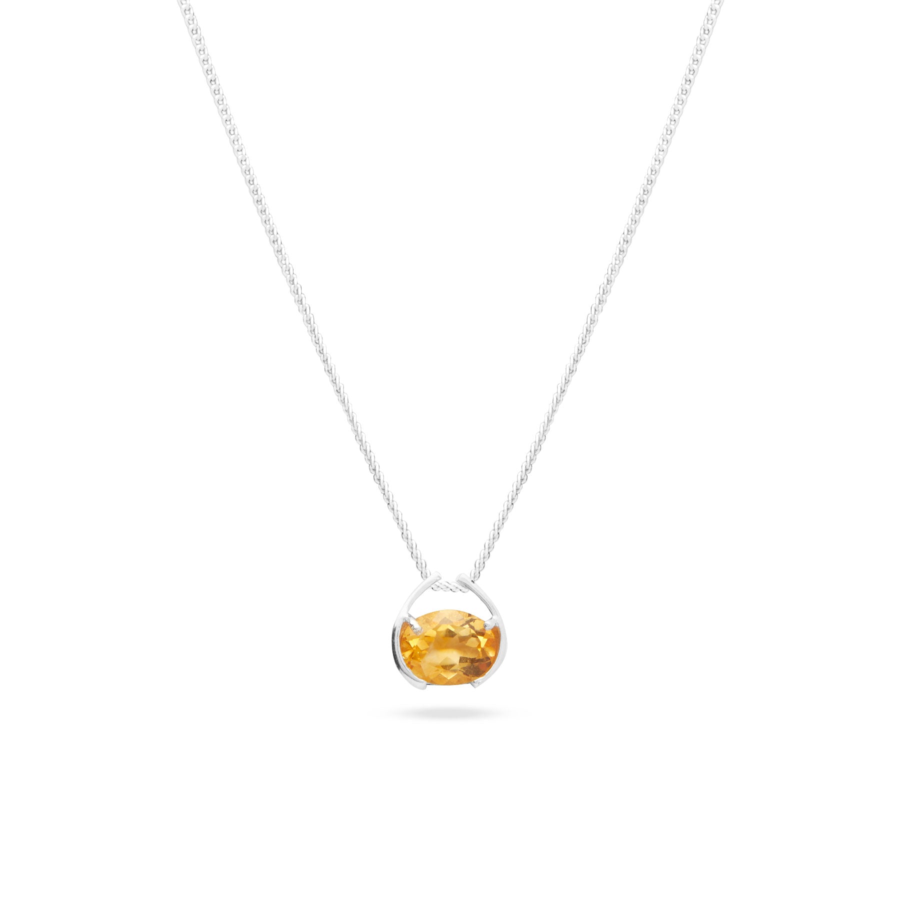 Citrine faceted oval pendant with claw and clamp bezel 