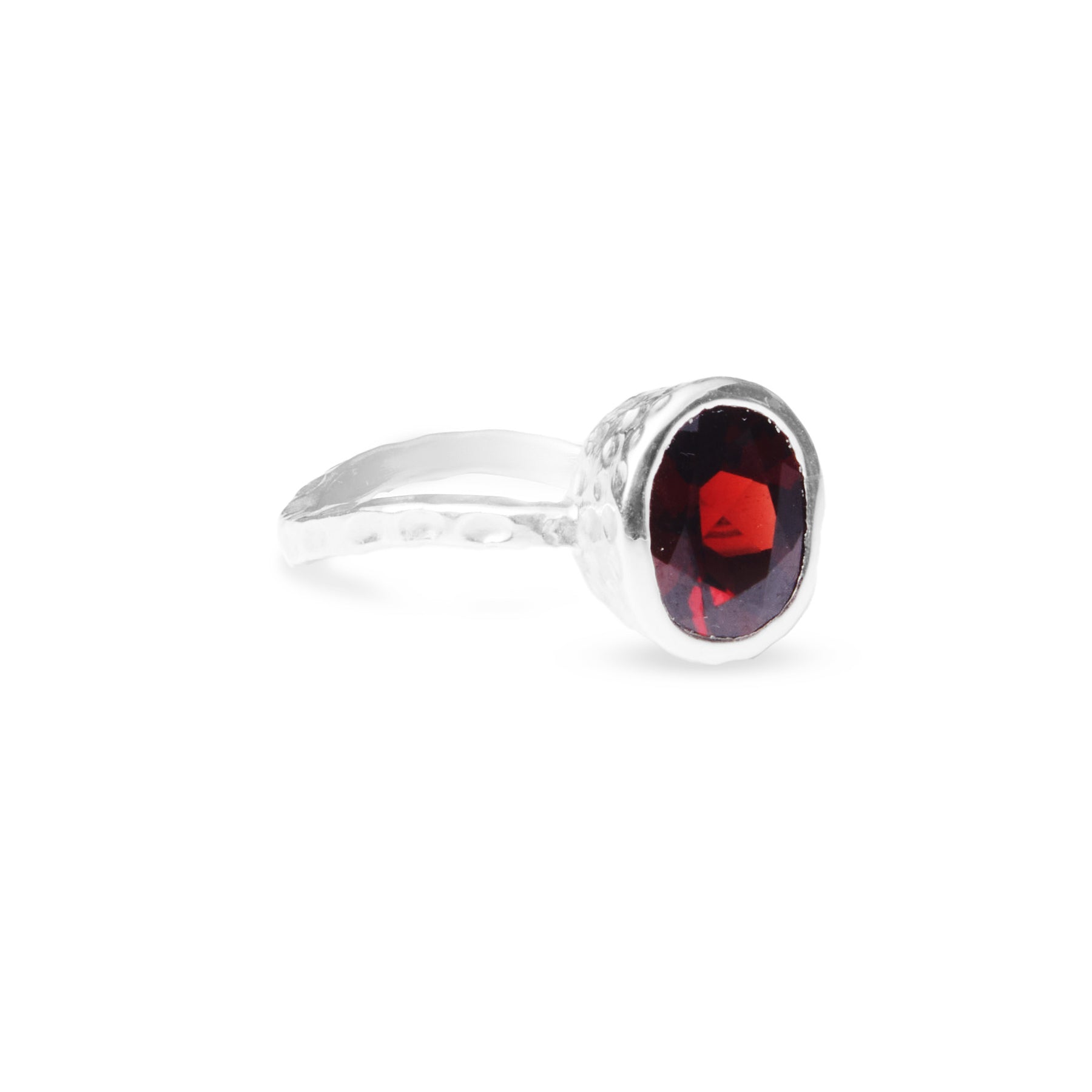 Garnet Oval faceted ring with bezel setting textured wave band side angle