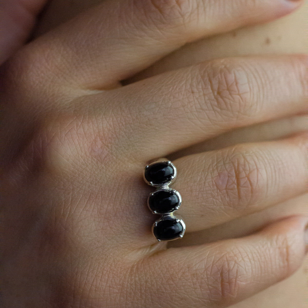 Triple stone Black star diopside oval ring with claw setting side angle