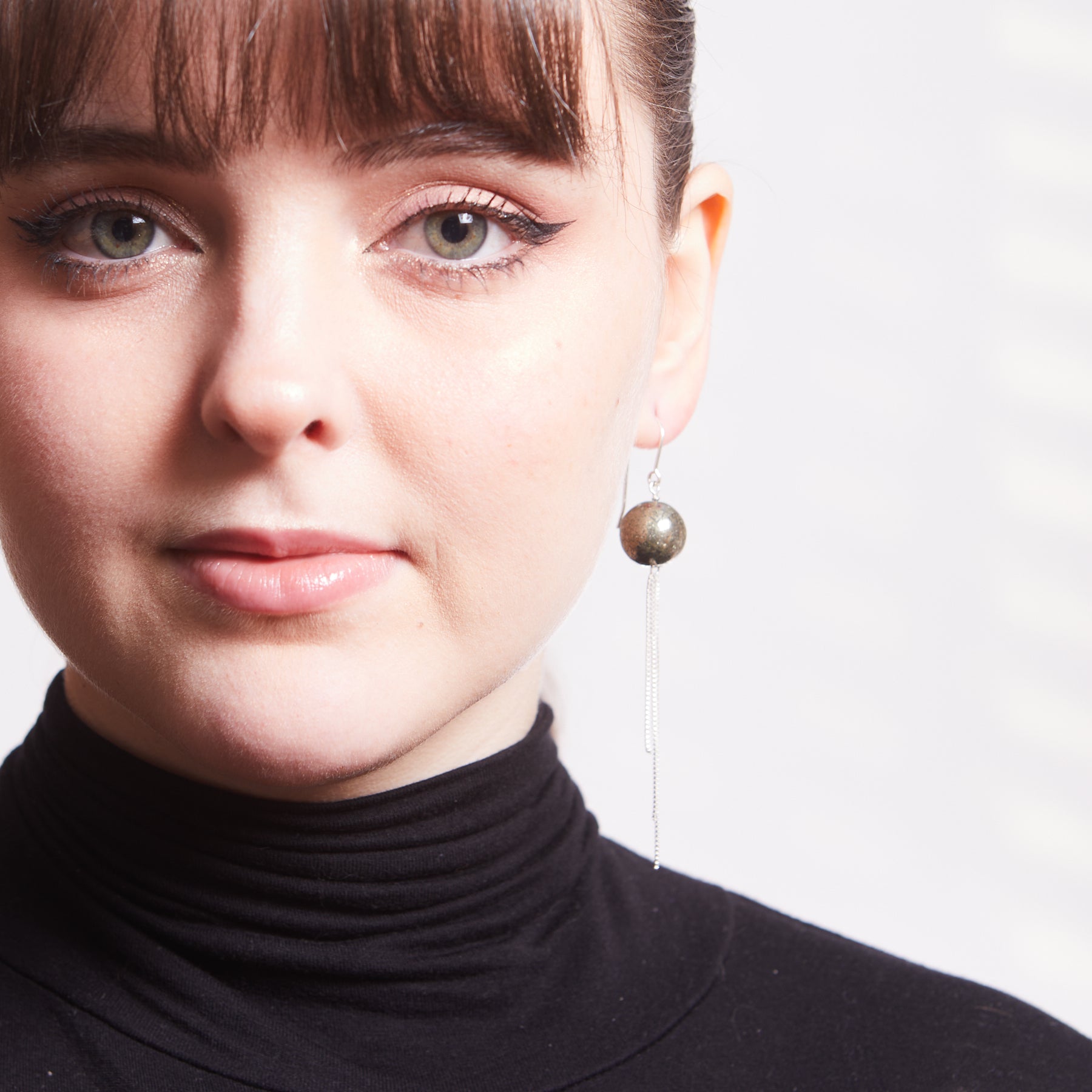 Pyrite drop Earrings with silver chains on models